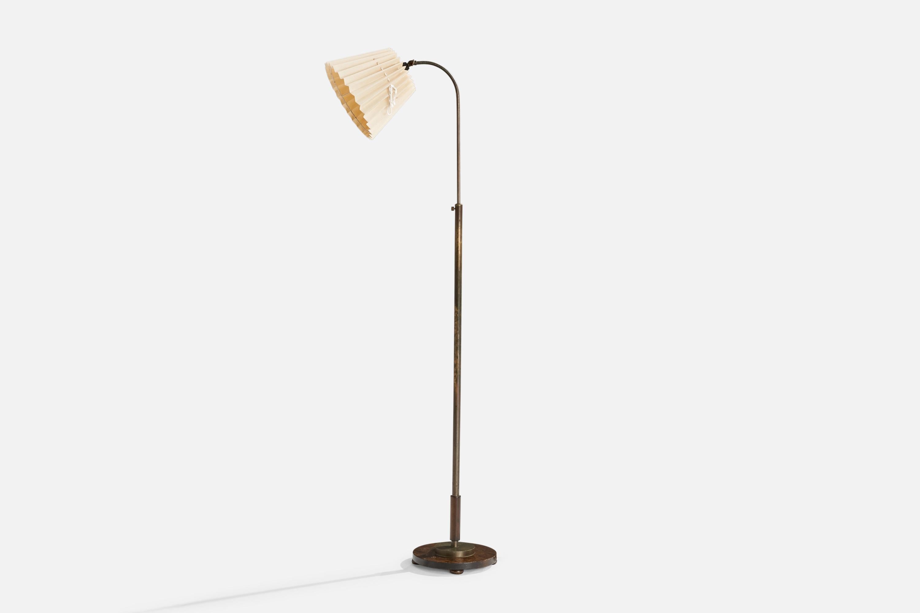 An adjustable brass, beige fabric and dark-stained birch floor lamp designed and produced in Sweden, 1920s.

Dimensions variable 
Overall Dimensions (inches): 59” H x9.75” W x 20.75” D
Stated dimensions include shade.
Bulb Specifications: E-26