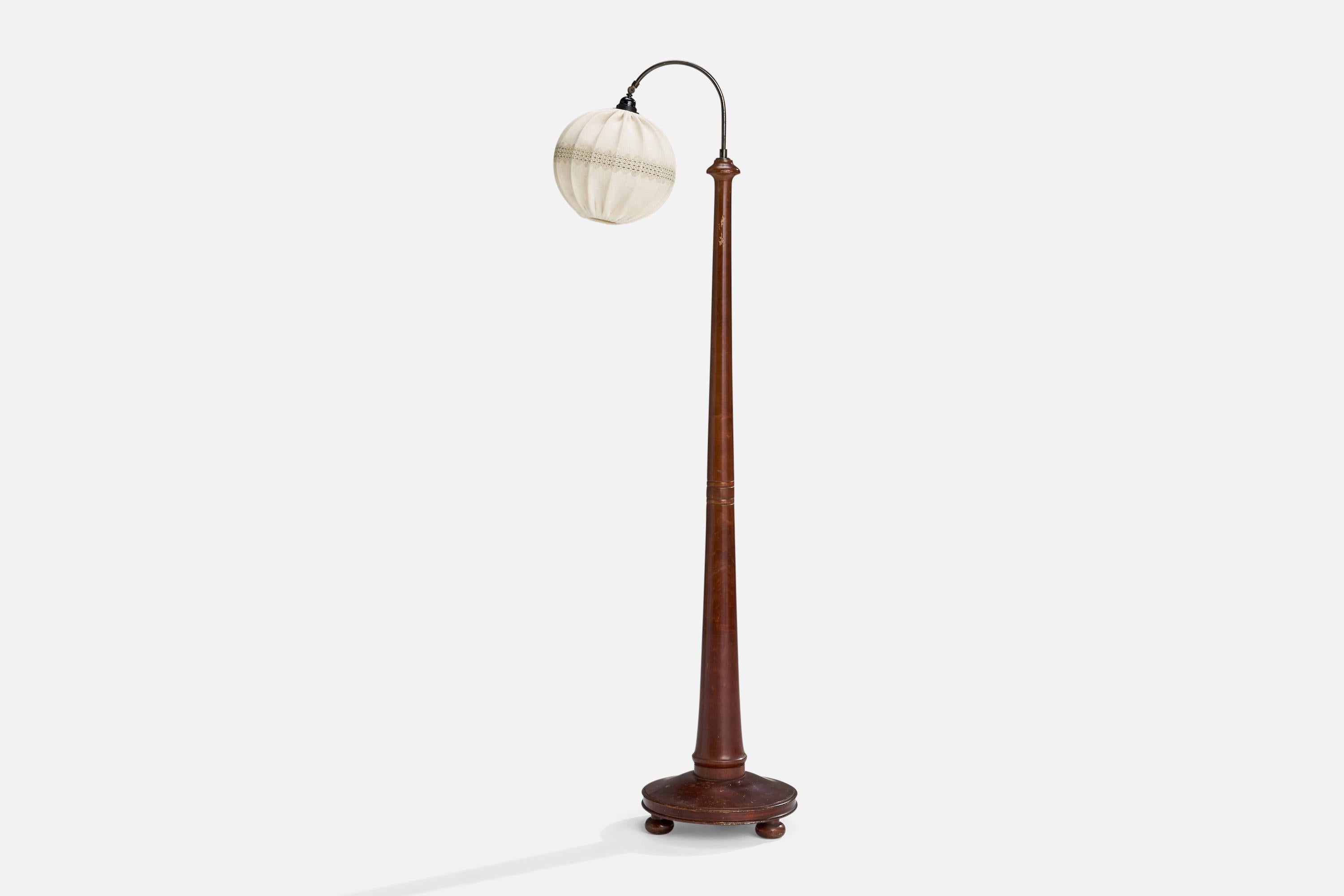 An adjustable brass, stained birch and fabric floor lamp designed and produced in Sweden, c. 1930s.

Overall Dimensions (inches): 64” H x 7.5” W x 21” D
Stated dimensions include shade.
Bulb Specifications: E-26 Bulb
Number of Sockets: 1
All