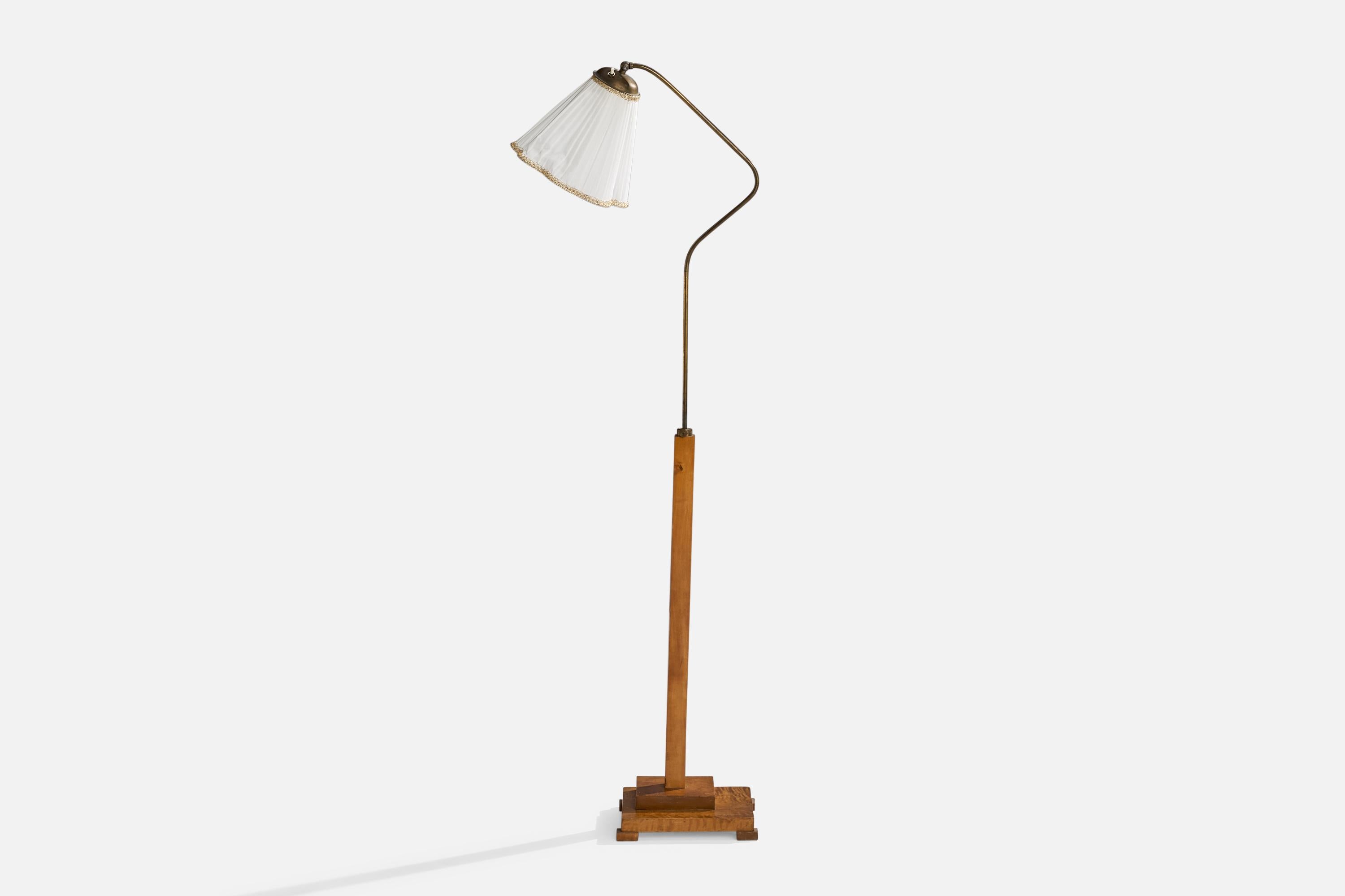 A brass, birch and white fabric floor lamp designed and produced in Sweden, 1930s.

Overall Dimensions (inches): 57.5”  H x 10” W x 18”  D
Stated dimensions include shade.
Bulb Specifications: E-26 Bulb
Number of Sockets: 1
All lighting will be