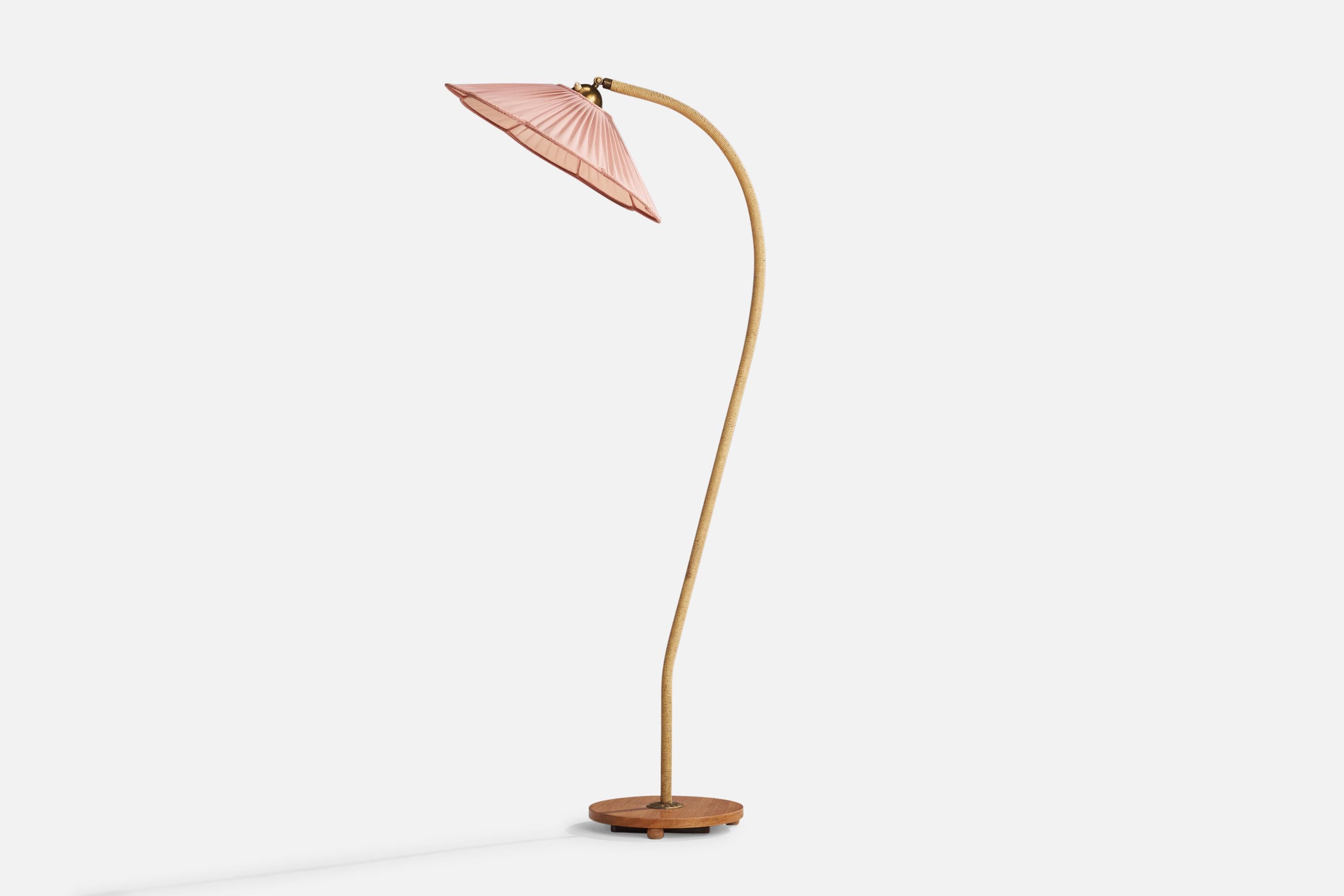 A brass, cord, elm and pink fabric floor lamp designed and produced in Sweden, 1940s.

Overall Dimensions (inches): 61”  H x 19.25”  W x 24” D
Stated dimensions include shade.
Bulb Specifications: E-26 Bulb
Number of Sockets: 1
All lighting will be