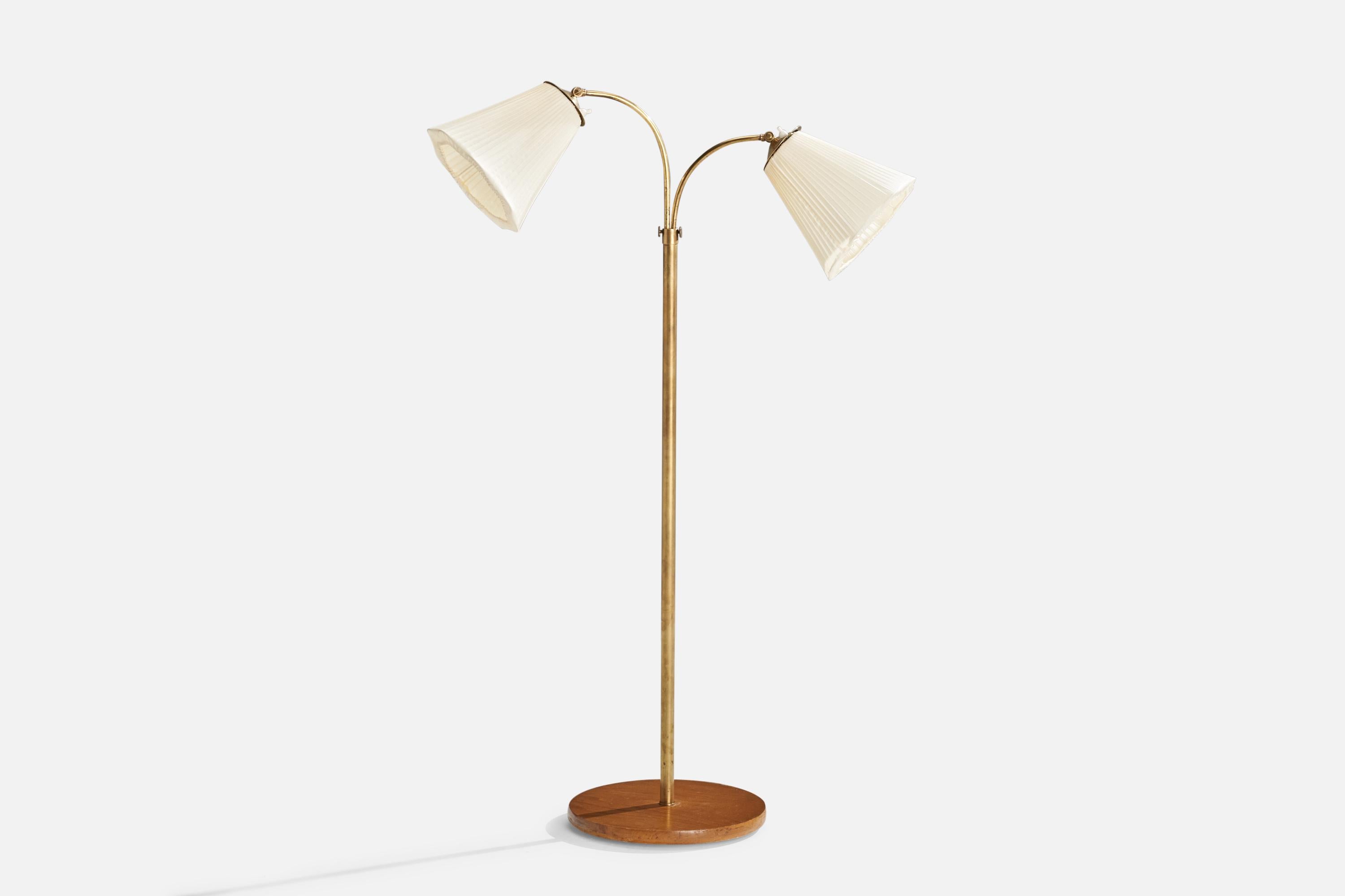 A brass, elm and off-white fabric floor lamp designed and produced in Sweden, c. 1940s.

Dimensions variable
Overall Dimensions (inches): 50” H x 33” W x 11.25” D
Stated dimensions include shade.
Bulb Specifications: E-26 Bulb
Number of Sockets: