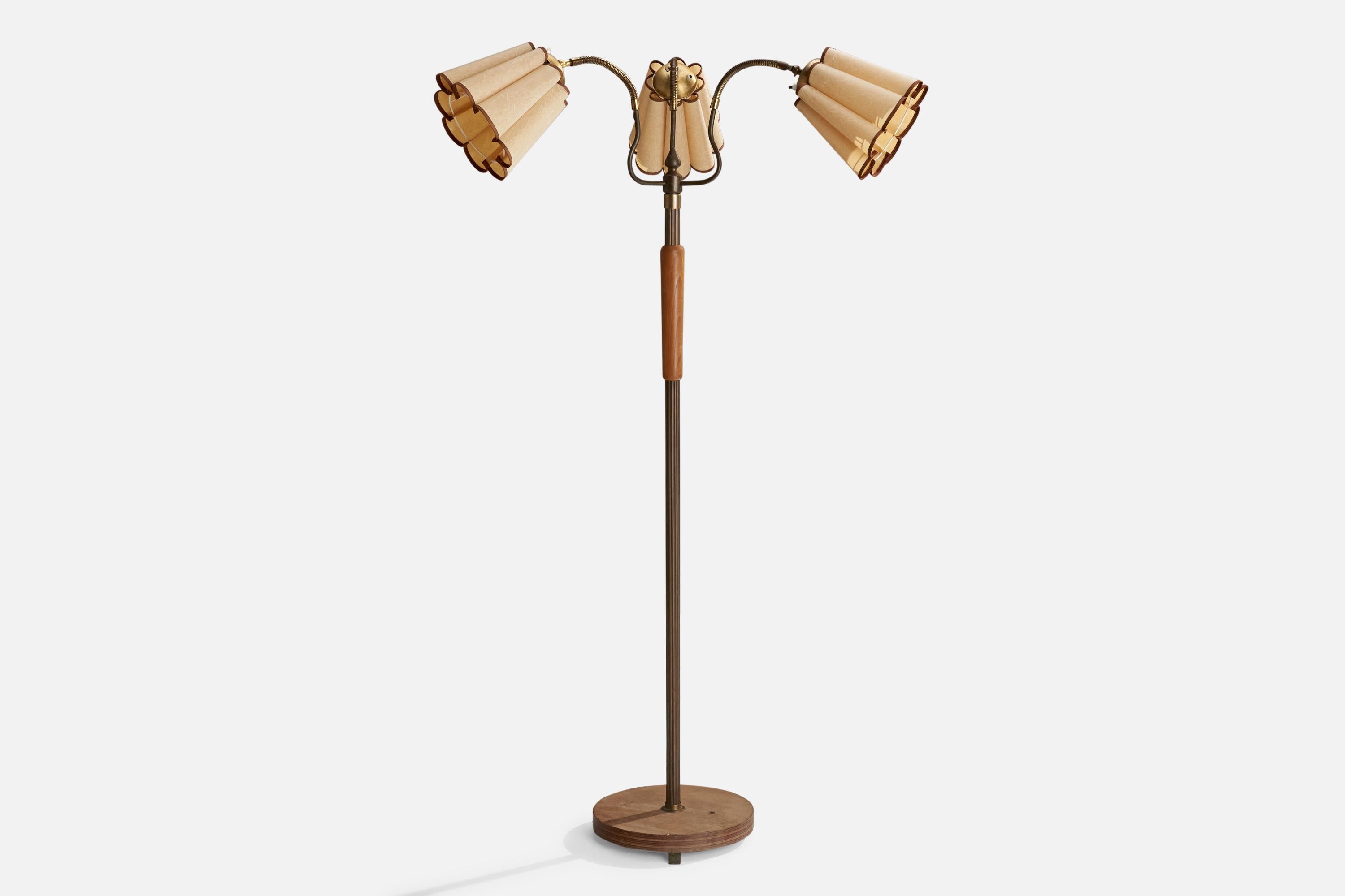 An adjustable three-armed brass, elm and paper floor lamp designed and produced in Sweden, 1940s.

Dimensions variable

Overall Dimensions (inches): 63” H x 24” D
Stated dimensions include shade.
Bulb Specifications: E-26 Bulb
Number of Sockets: