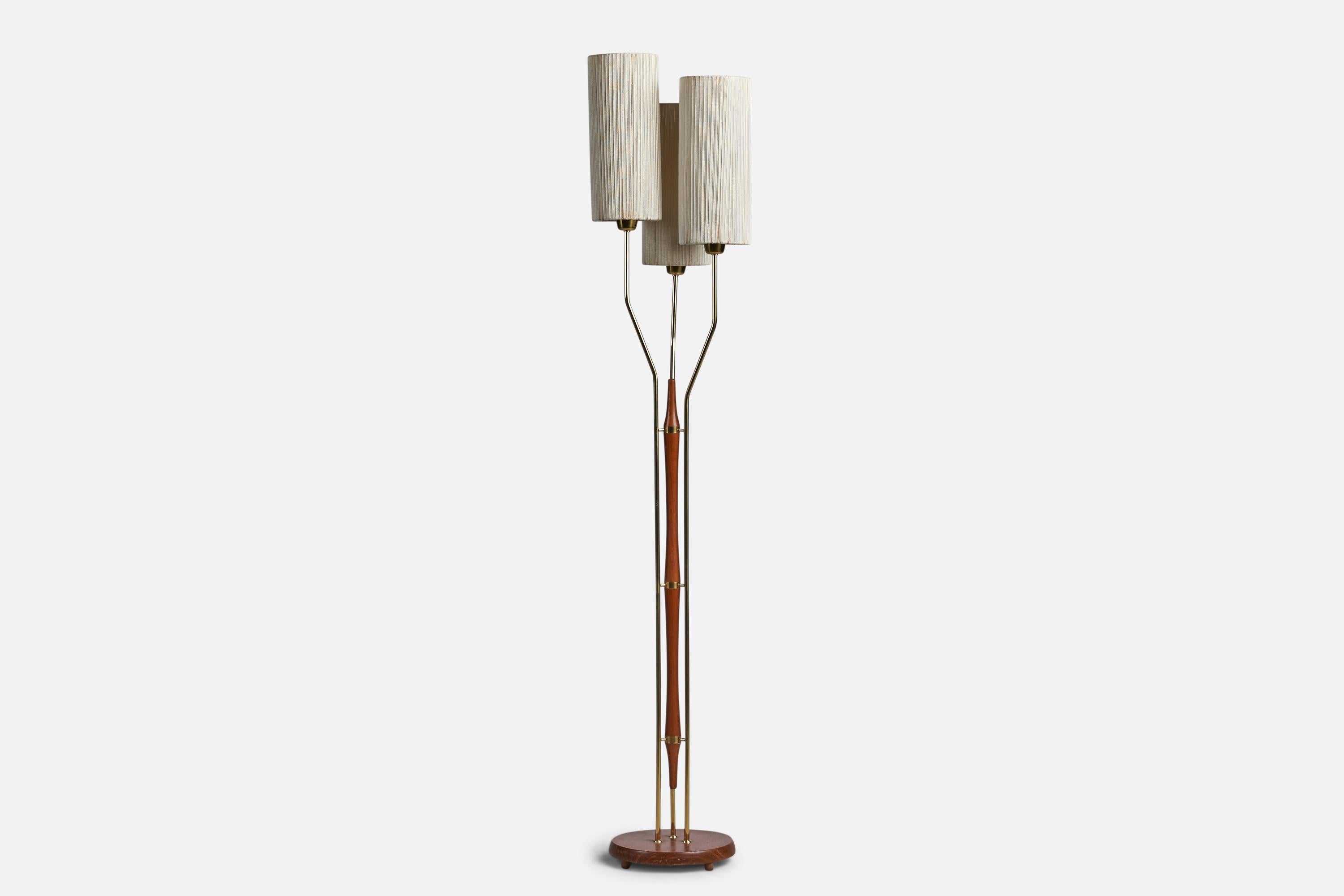 A brass, teak and fabric string floor lamp designed and produced in Sweden, 1950s.

Overall Dimensions (inches): 58.75” H x 11.25” Diameter
Bulb Specifications: E-26 Bulb
Number of Sockets: 1
All lighting will be converted for US usage. We are