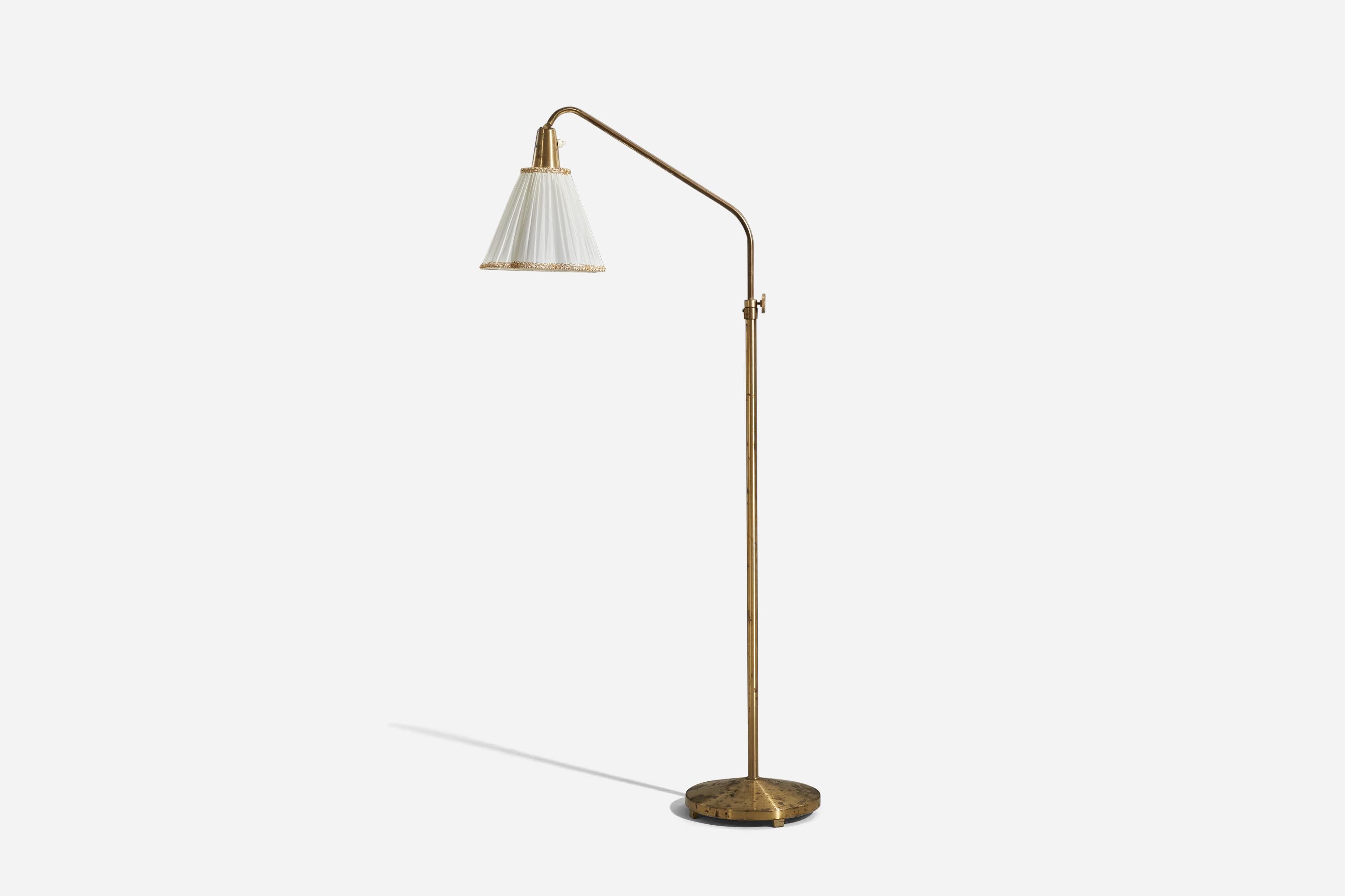 A brass and fabric floor lamp designed and produced by a Swedish designer, Sweden, 1930s. 

Variable dimensions, measured as illustrated in the first image.