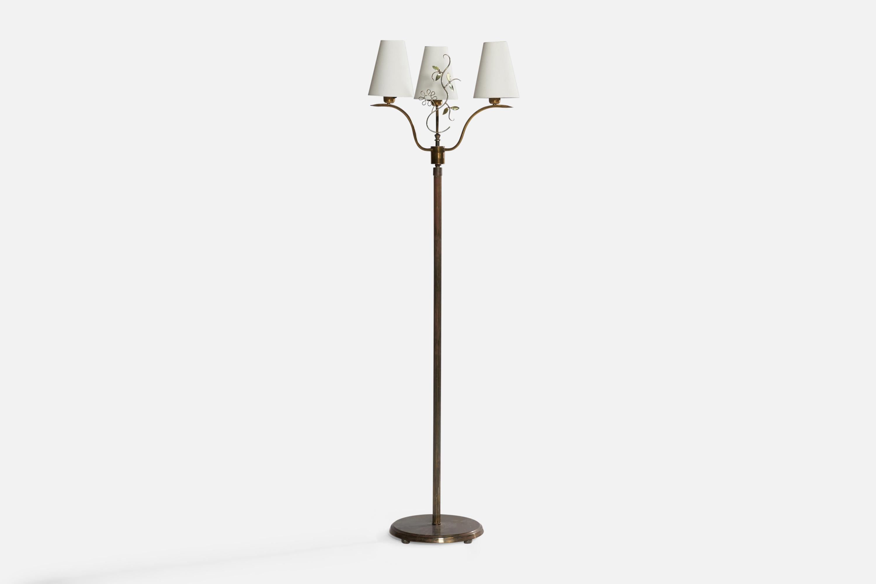 A brass and fabric floor lamp designed and produced in Sweden, c. 1930s.

Overall Dimensions (inches): 61.45” H x 18” W x 18”. Stated dimensions include shades.
Bulb Specifications: E-26 Bulb
Number of Sockets: 3
All lighting will be converted for