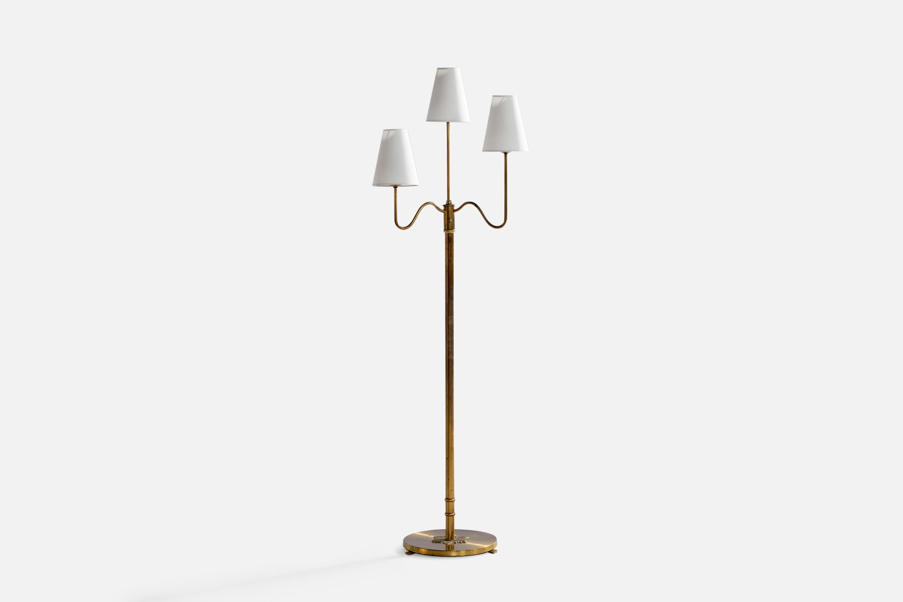A three-armed brass and white fabric floor designed and produced in Sweden, 1930s.

Overall Dimensions (inches): 58.75” H x 19” W x 13.5”. Stated dimensions include shades.
Bulb Specifications: E-26 Bulbs
Number of Sockets: 3
All lighting will be