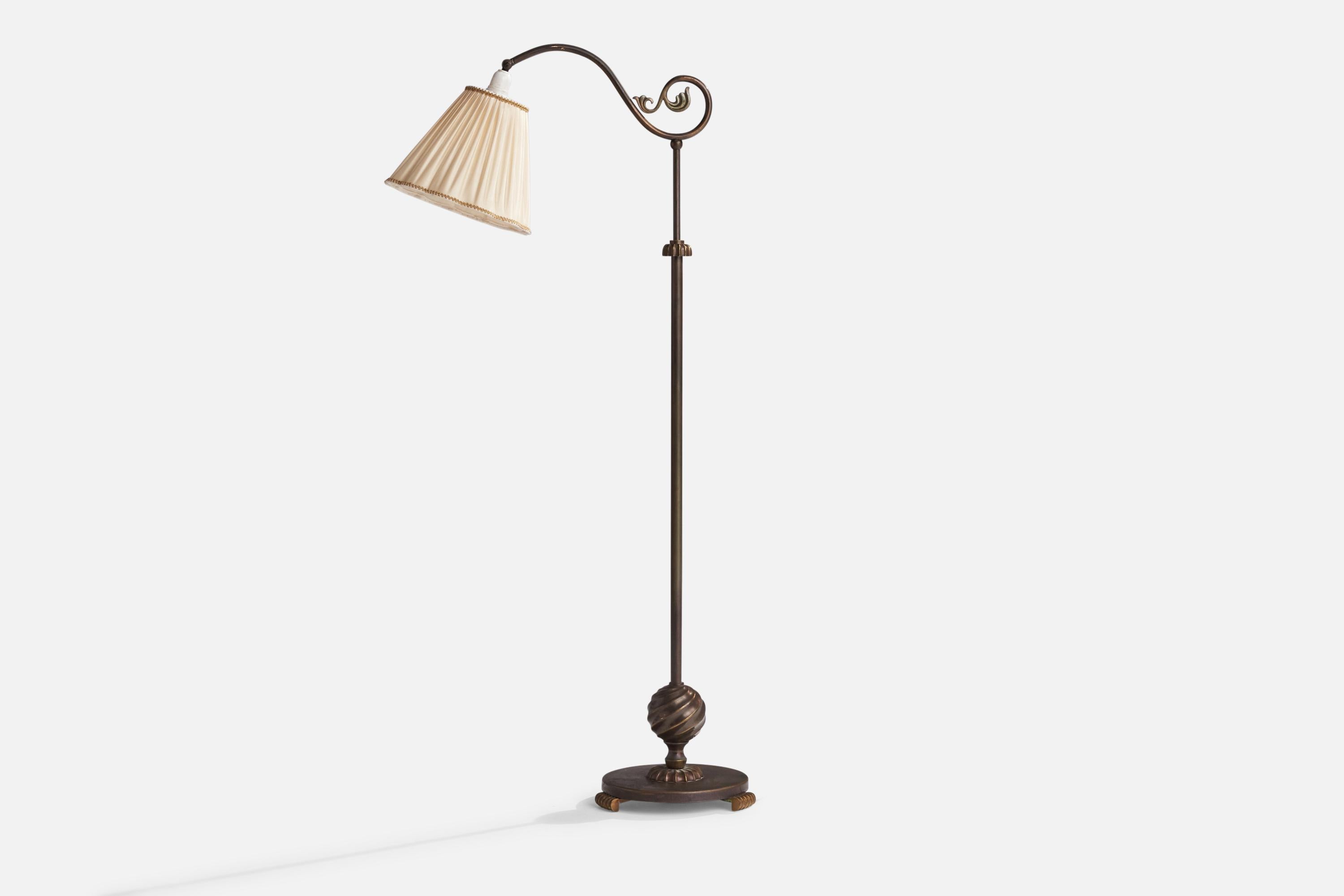 A brass and off-white fabric floor lamp designed and produced in Sweden, 1930s.

Dimensions variable

Overall Dimensions (inches): 51”  H x 10” W x 21.5” D
Stated dimensions include shade.
Bulb Specifications: E-26 Bulb
Number of Sockets: 1
All