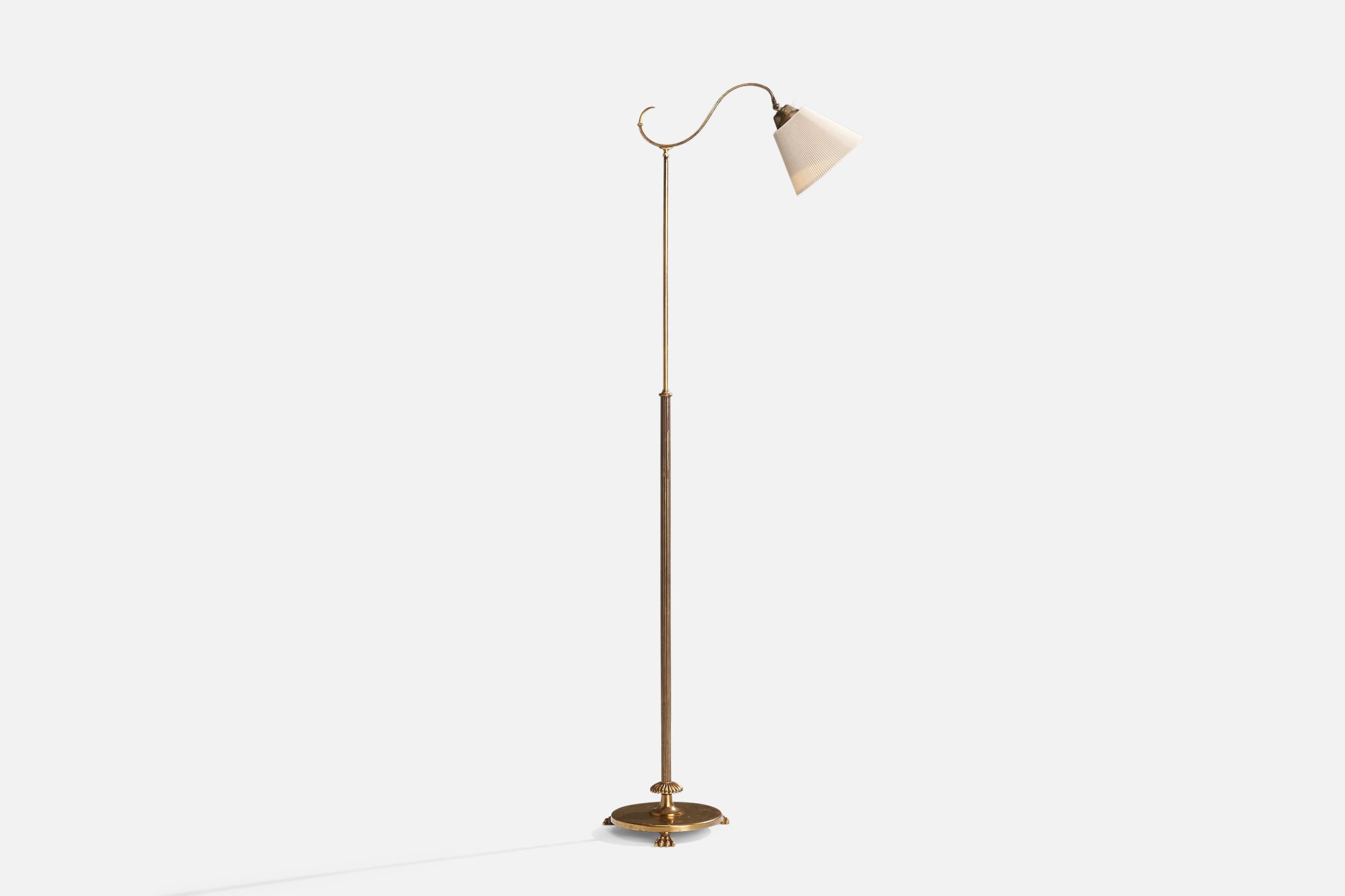 An adjustable brass and off-white fabric floor lamp designed and produced in Sweden, c. 1930s.

Dimensions variable 
Overall Dimensions (inches): 58.5” H x 8.75” W x 25” D
Stated dimensions include shade.
Bulb Specifications: E-26 Bulb
Number of