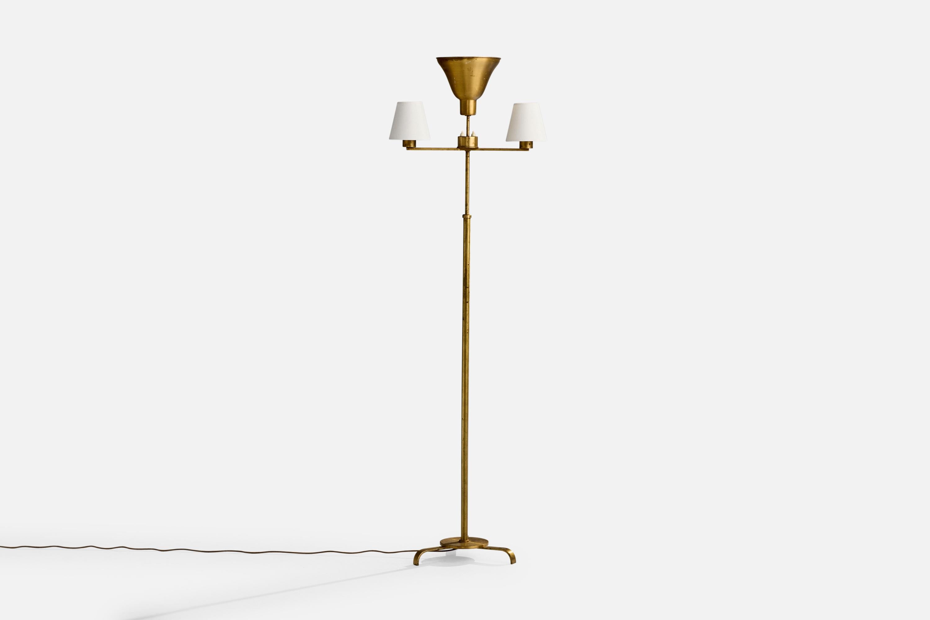 A brass and white fabric floor lamp likely designed and produced in Sweden, c. 1930s.

Dimensions of Lamp with Shade (inches): 59.5