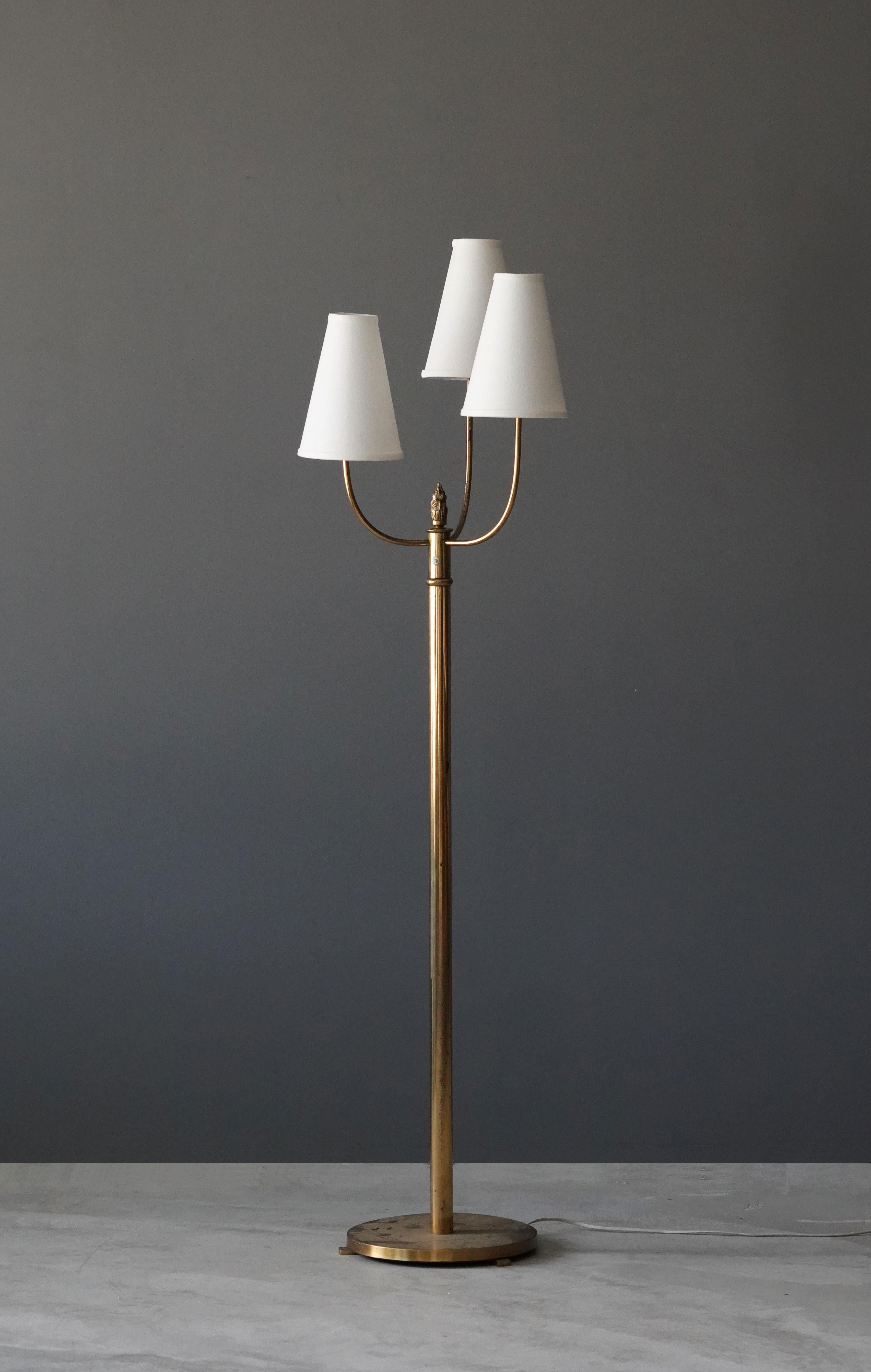A three-armed functionalist floor lamp. With brand new high-end lampshades.

Other designers of the period include Josef Frank, Paavo Tynell, Hans Agne Jacobsen, and Alvar Aalto.