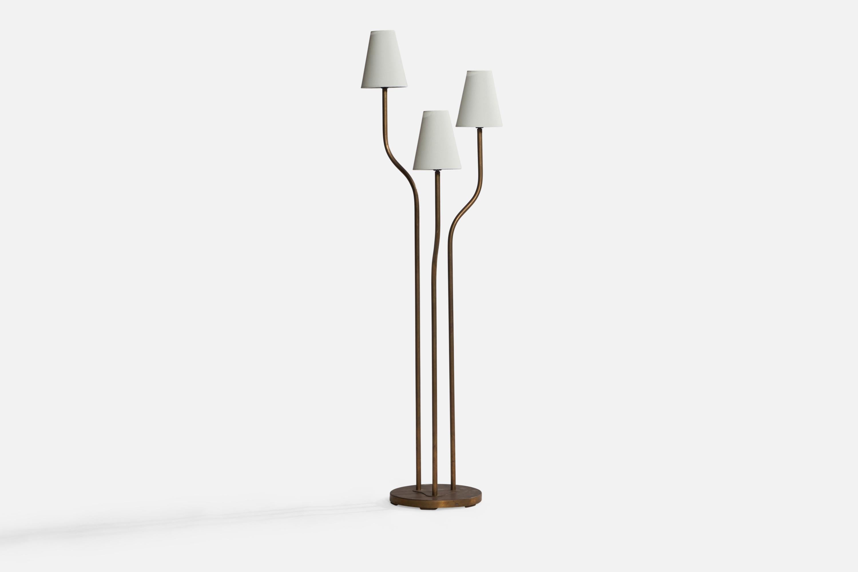 A three-armed brass and white fabric floor lamp designed and produced in Sweden, c. 1940s.

Overall Dimensions (inches): 55.45” H x 16.35” W x 15.25” D. Stated dimensions include shade.
Bulb Specifications: E-26 Bulbs
Number of Sockets: 3
All