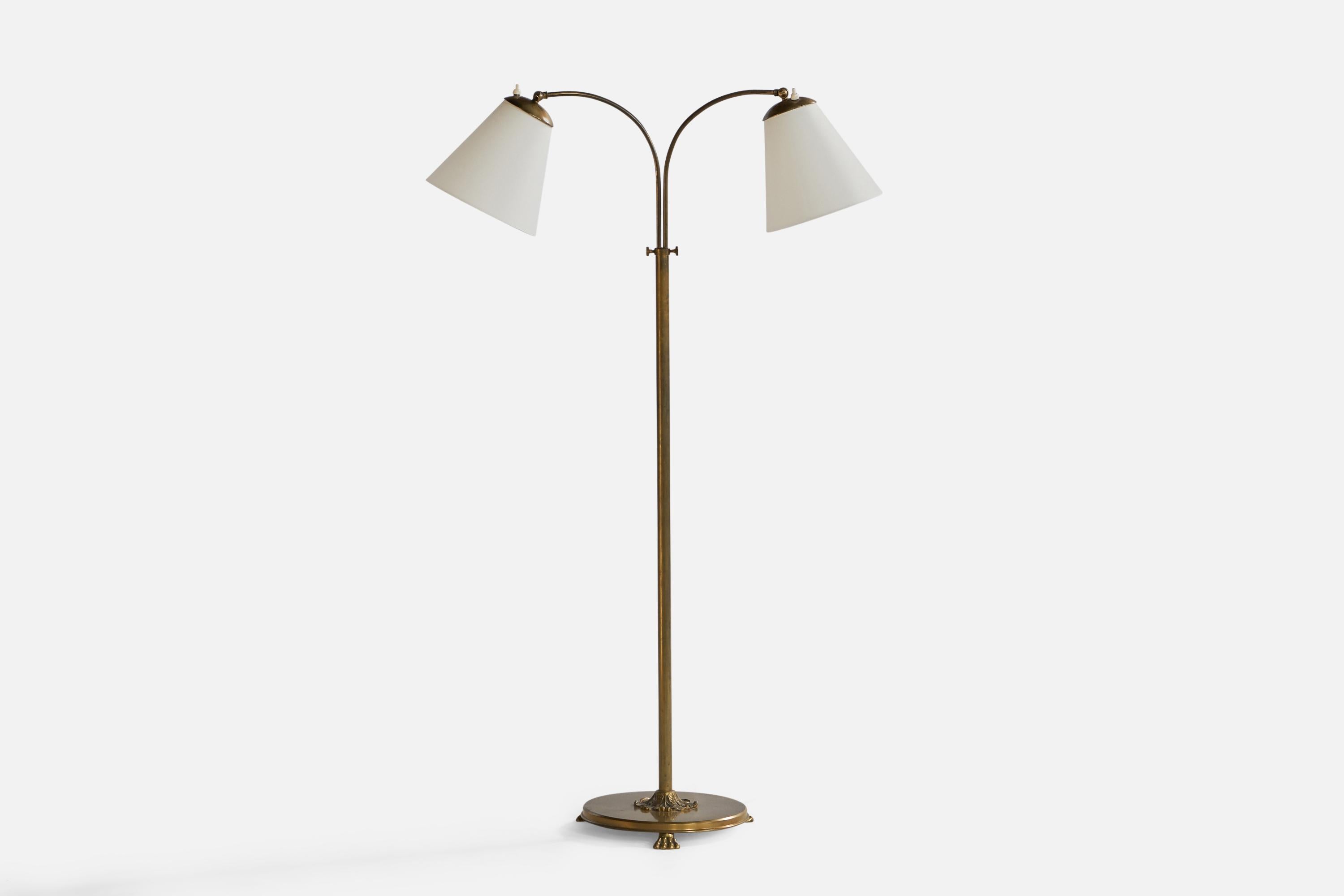 An adjustable two-armed brass and white fabric floor lamp designed and produced in Sweden, 1940s.

Overall Dimensions (inches): 51.6” H x 33.25” W x 12.26” Depth. Stated dimensions include shades.
Dimensions vary based on position of light. Height