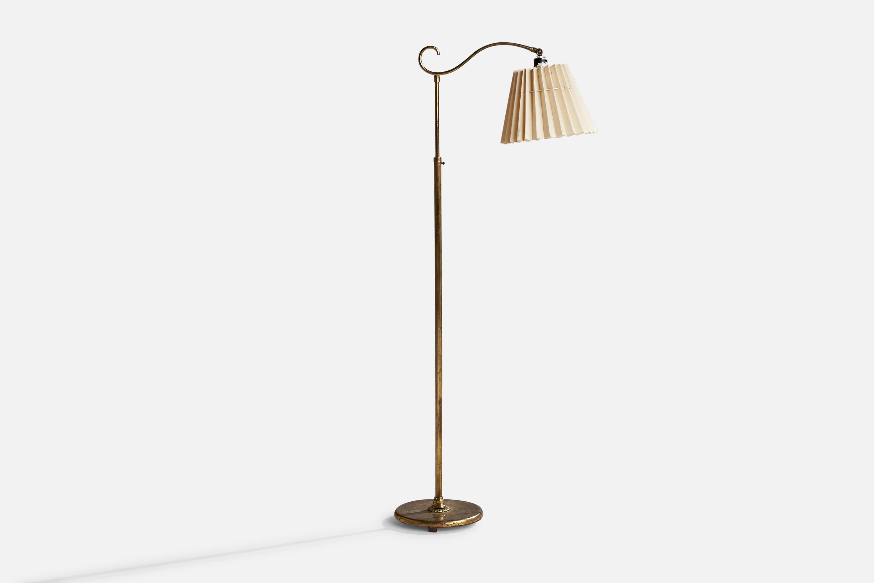 A brass and light-beige fabric floor lamp designed and produced in Sweden, 1940s.

Overall Dimensions (inches): 54.5” H x 10”  W x 20” D
Stated dimensions include shade.
Bulb Specifications: E-26 Bulb
Number of Sockets: 1
All lighting will be