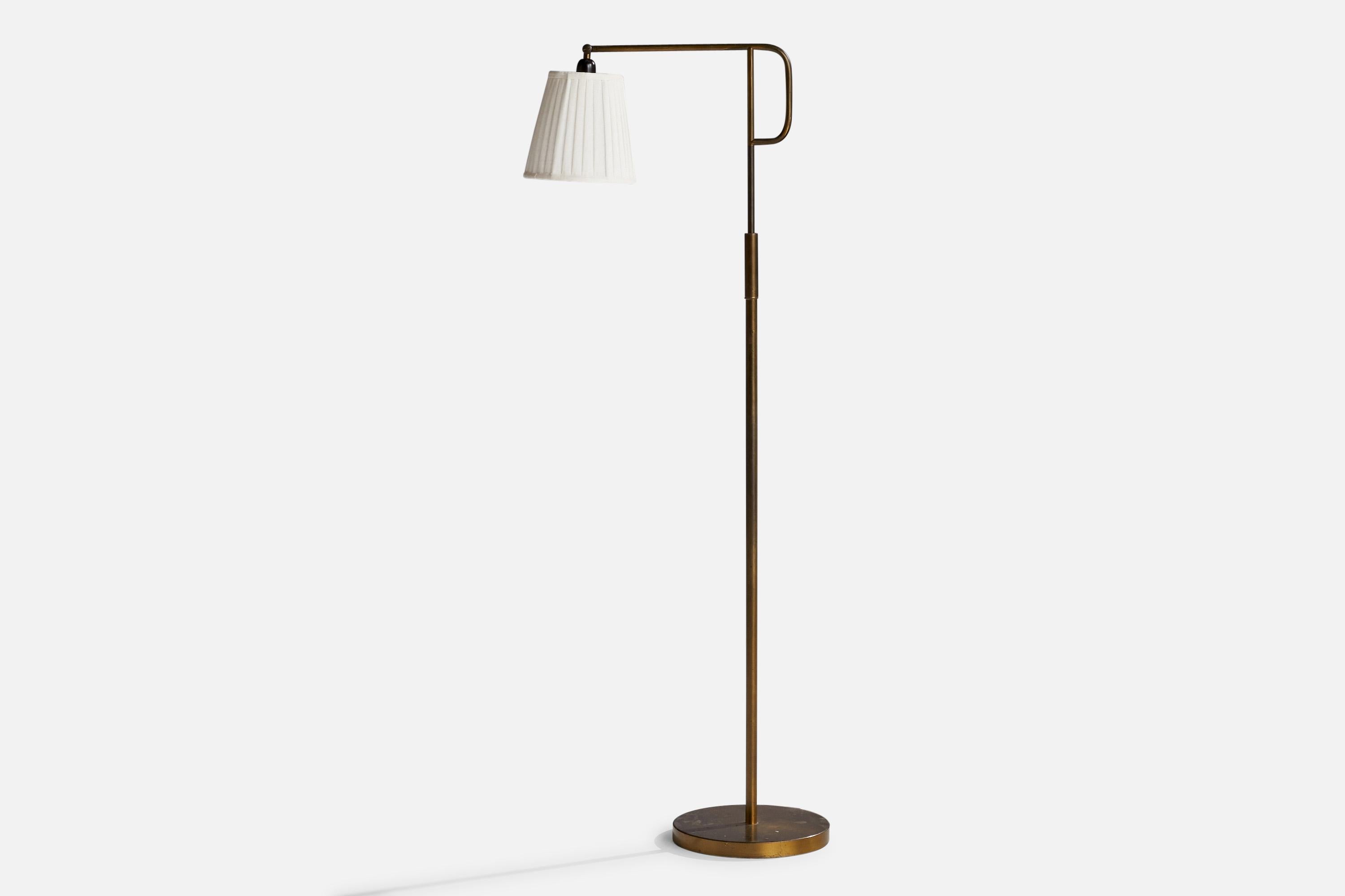 An adjustable brass and white fabric floor lamp designed and produced in Sweden, 1940s.

Dimensions will vary depending upon adjustment.
Overall Dimensions (inches): 63” H x 8”  W x 20”  D
Stated dimensions include shade.
Bulb Specifications: E-26