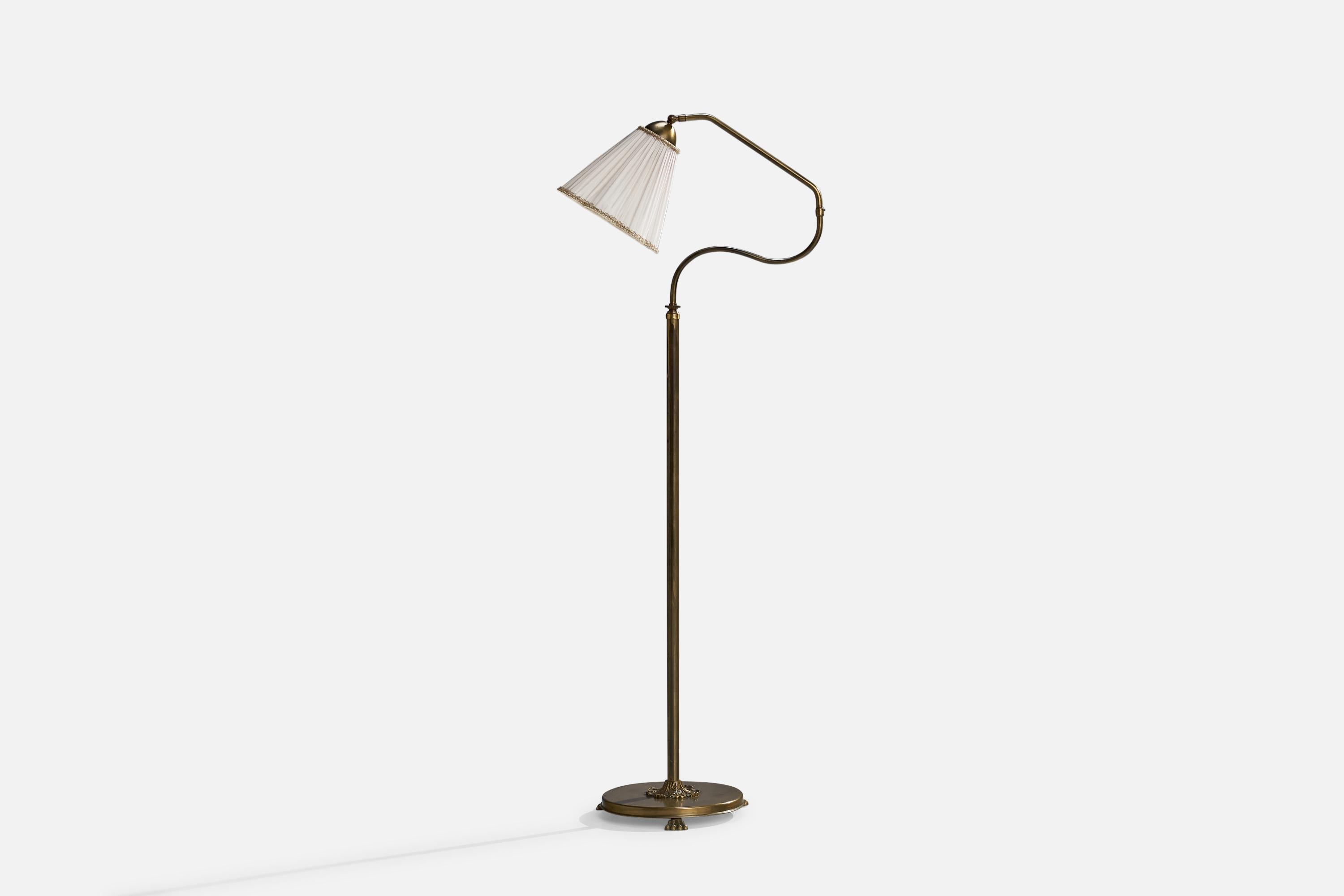 An adjustable brass and white fabric floor lamp designed and produced in Sweden, 1940s.

Overall Dimensions (inches): 57”  H x 21.5” W x 13” D
Stated dimensions include shade.
Bulb Specifications: E-26 Bulb
Number of Sockets: 1
All lighting will be