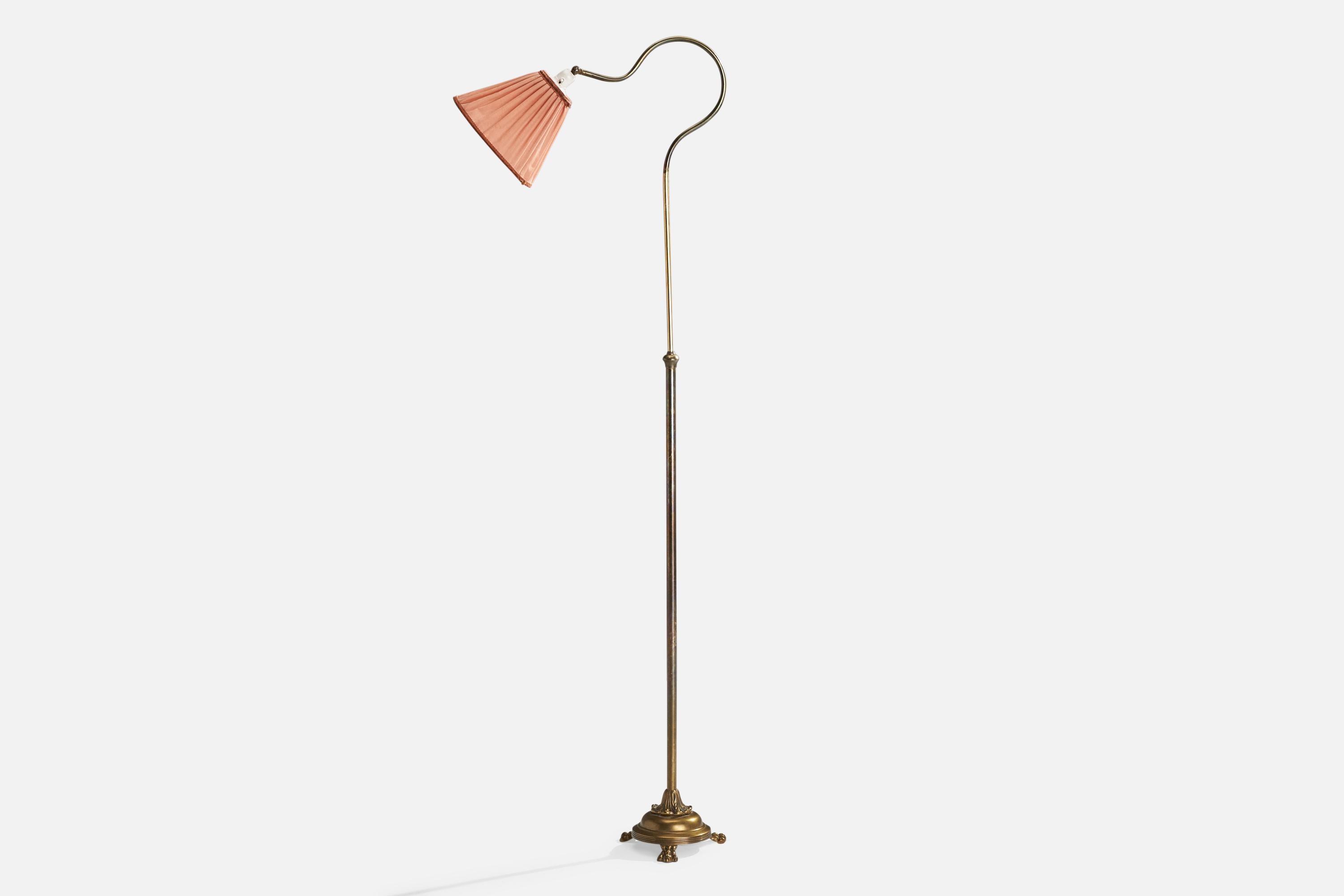 An adjustable brass and pink fabric floor lamp designed and produced in Sweden, c. 1940s.

Overall Dimensions (inches): 54.5” H x 10” W x 19.75” D
Stated dimensions include shade.
Bulb Specifications: E-26 Bulb
Number of Sockets: 1
All lighting will