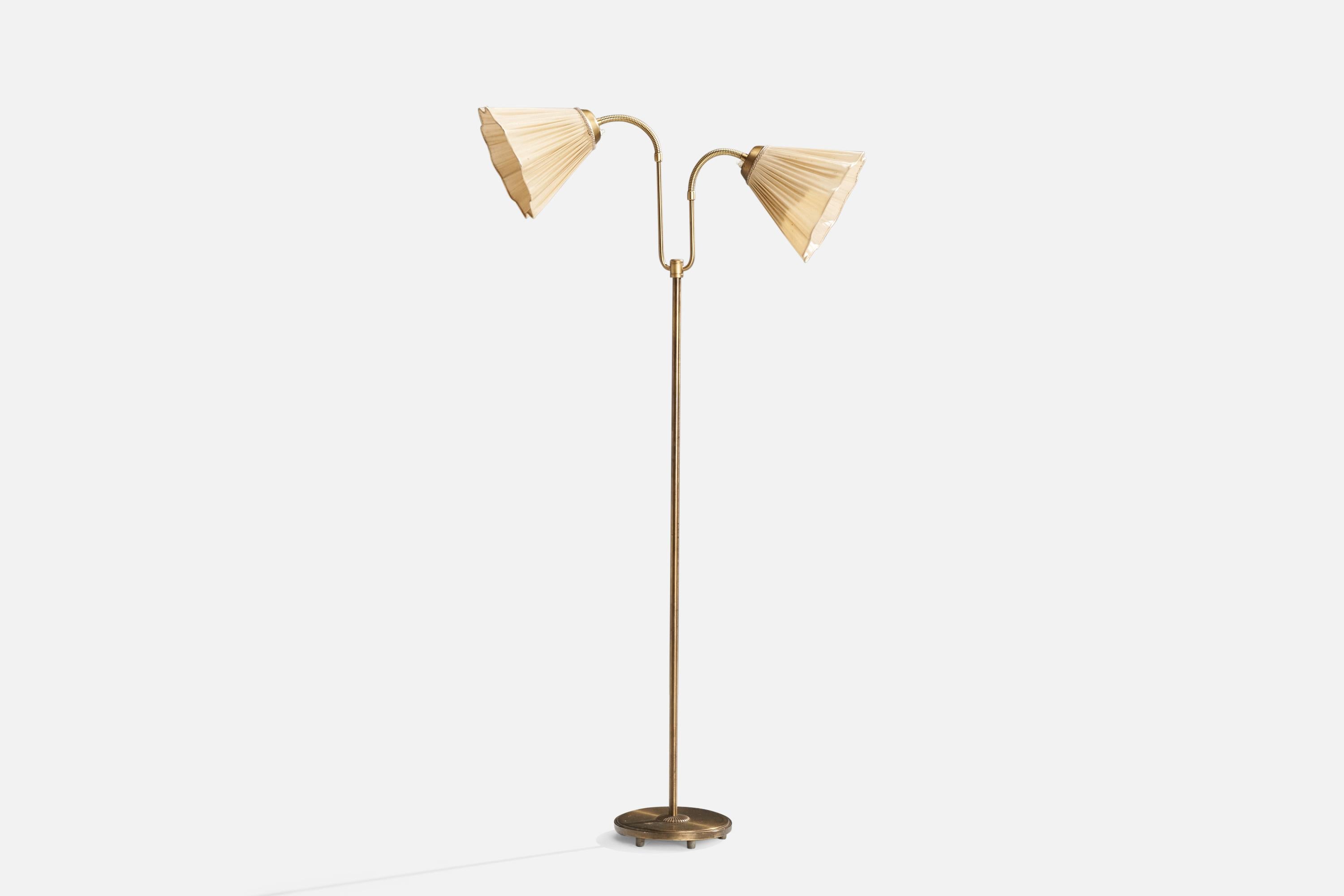 An adjustable brass and beige fabric floor lamp designed and produced in Sweden, c. 1940s.

Dimensions variable 
Overall Dimensions (inches): 61.25” H x 32.25” W x 12” D
Stated dimensions include shade.
Bulb Specifications: E-26 Bulb
Number of