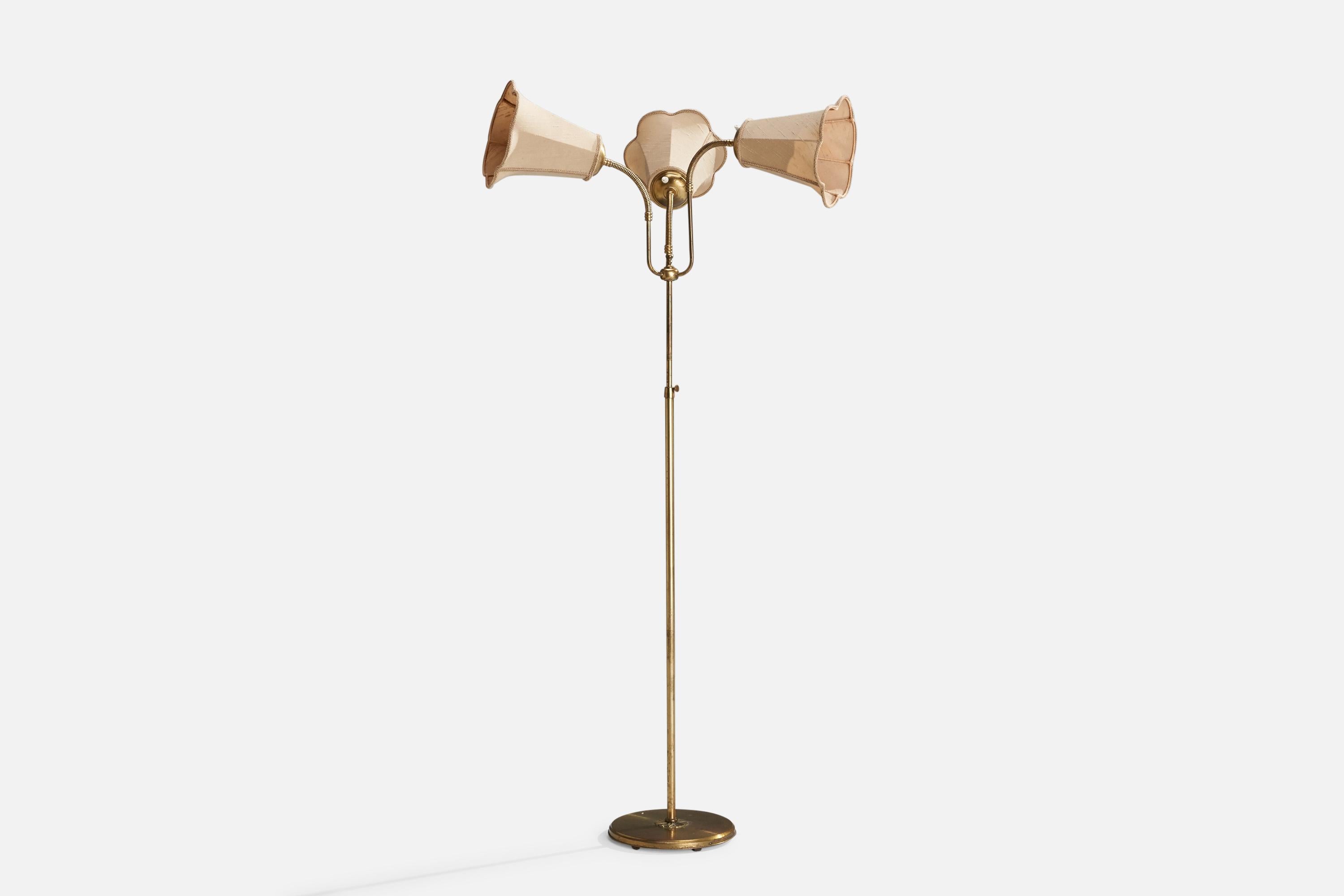An adjustable brass and light pink fabric floor lamp designed and produced in Sweden, c. 1940s.

Dimensions variable 
Overall Dimensions (inches):59.75” H x 32.25” W x 23.5” D
Stated dimensions include shade.
Bulb Specifications: E-26 Bulb
Number of