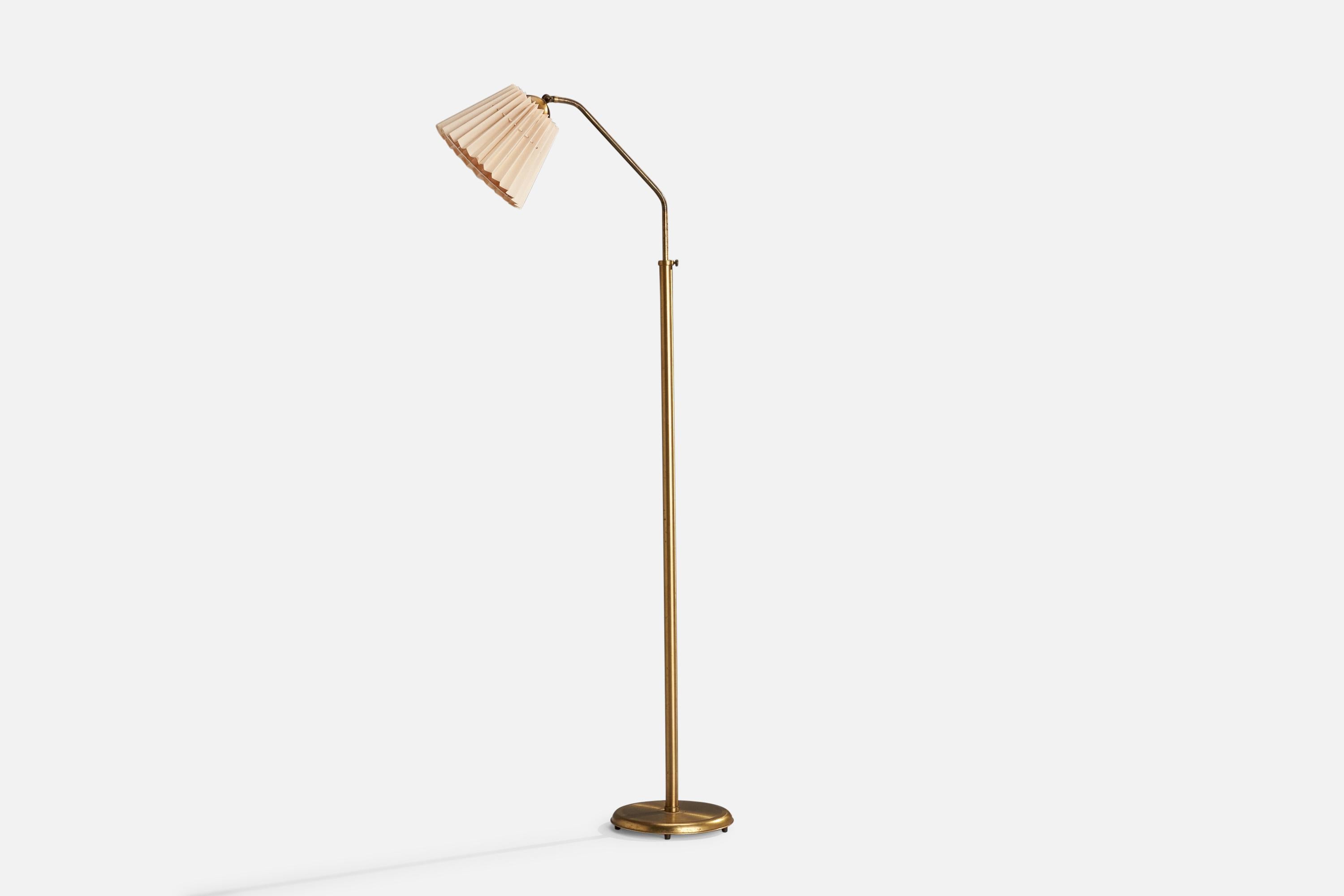 An adjustable brass and light pink fabric floor lamp designed and produced in Sweden, c. 1940s.

Dimensions variable 
Overall Dimensions (inches): 60.25” H x 9.5” W x 24.5@” D
Stated dimensions include shade.
Bulb Specifications: E-26 Bulb
Number of