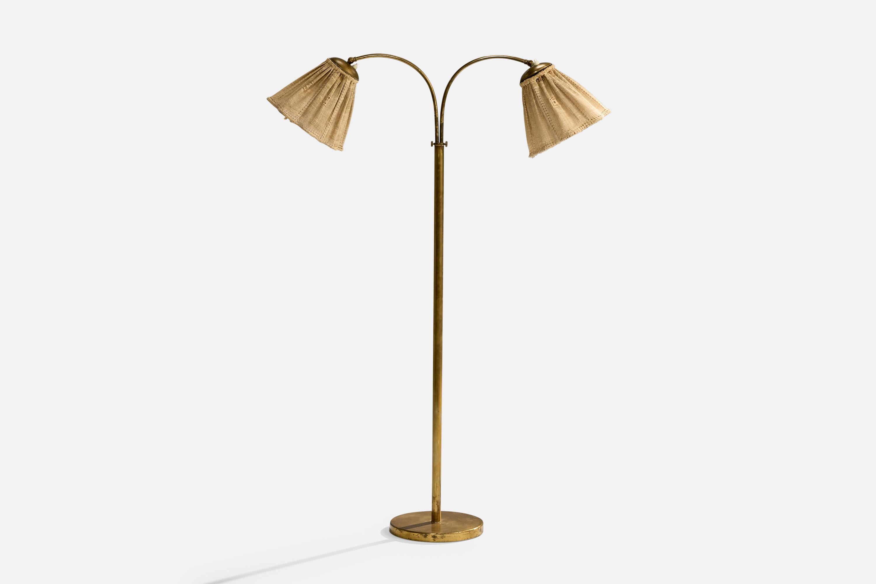 An adjustable brass and beige embroidery fabric floor lamp designed and produced in Sweden, c. 1940s.

Dimensions of Lamp with Shade (inches): 55.125“ H x 36“ W x 11“ D

Bulb Specifications: E-26

Number of Sockets (per fixture): 2

Sold with
