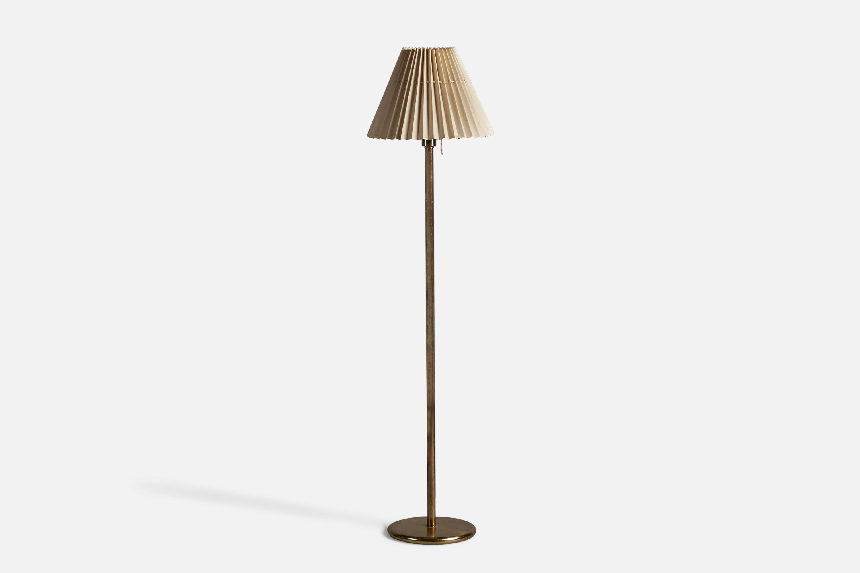 A brass and fabric floor lamp, designed and produced in Sweden, 1950s. 
Overall Dimensions (inches): 55.5