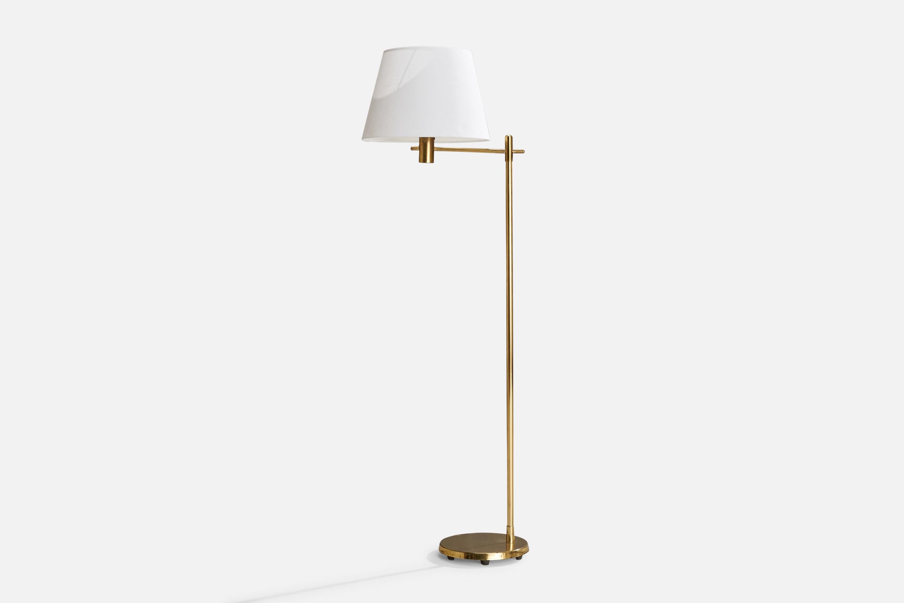 A brass and white fabric floor lamp designed and produced in Sweden, c. 1970s.

Overall Dimensions (inches): 56” H x 13.75” W x 19.25” D
Stated dimensions include shade.
Bulb Specifications: E-26 Bulb
Number of Sockets: 1
All lighting will be