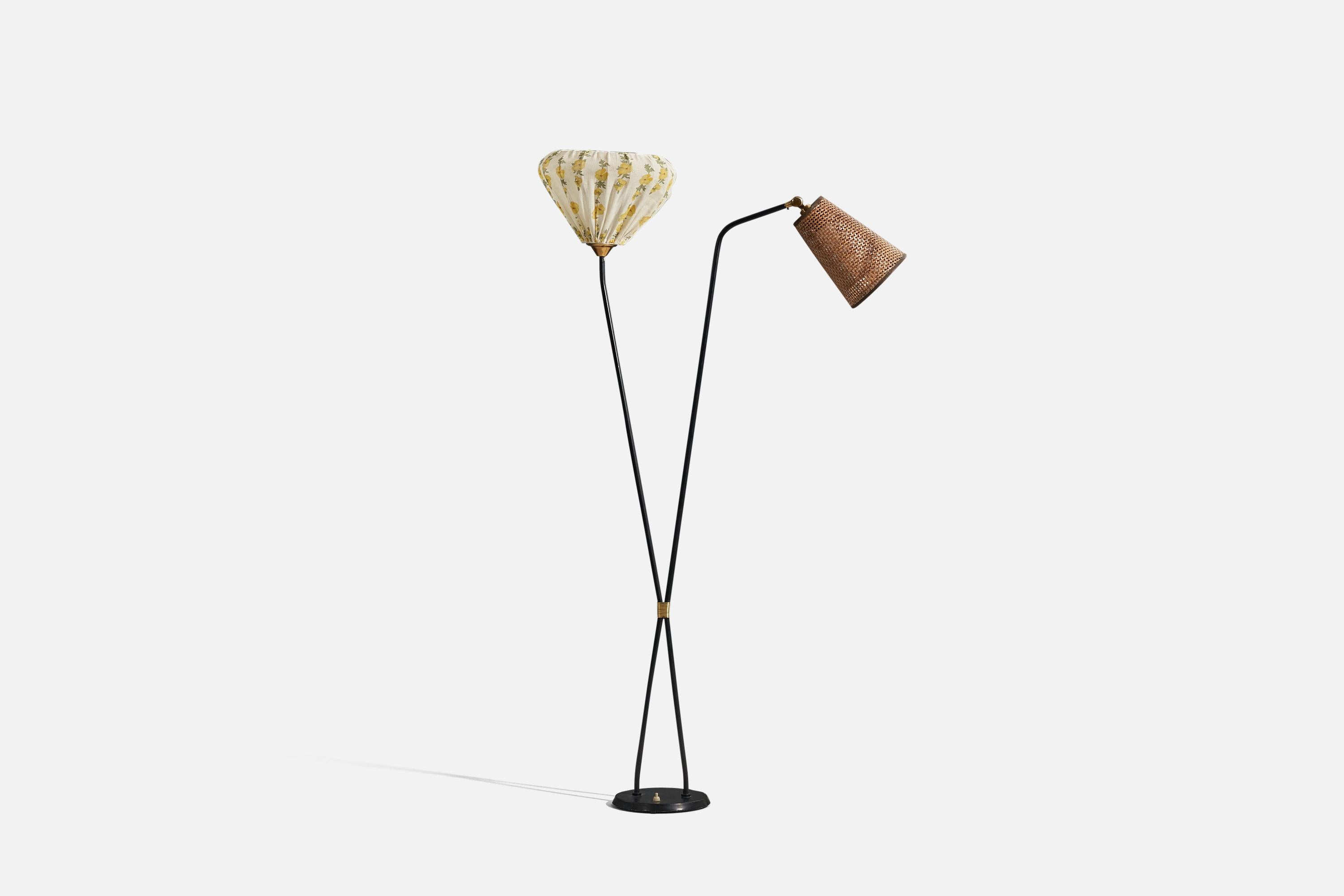 A brass, metal, rattan and fabric floor lamp designed and produced by a Swedish designer, Sweden, 1950s. 

Sold with lampshades. 
Dimensions stated refer to the floor lamp with the lampshades.

