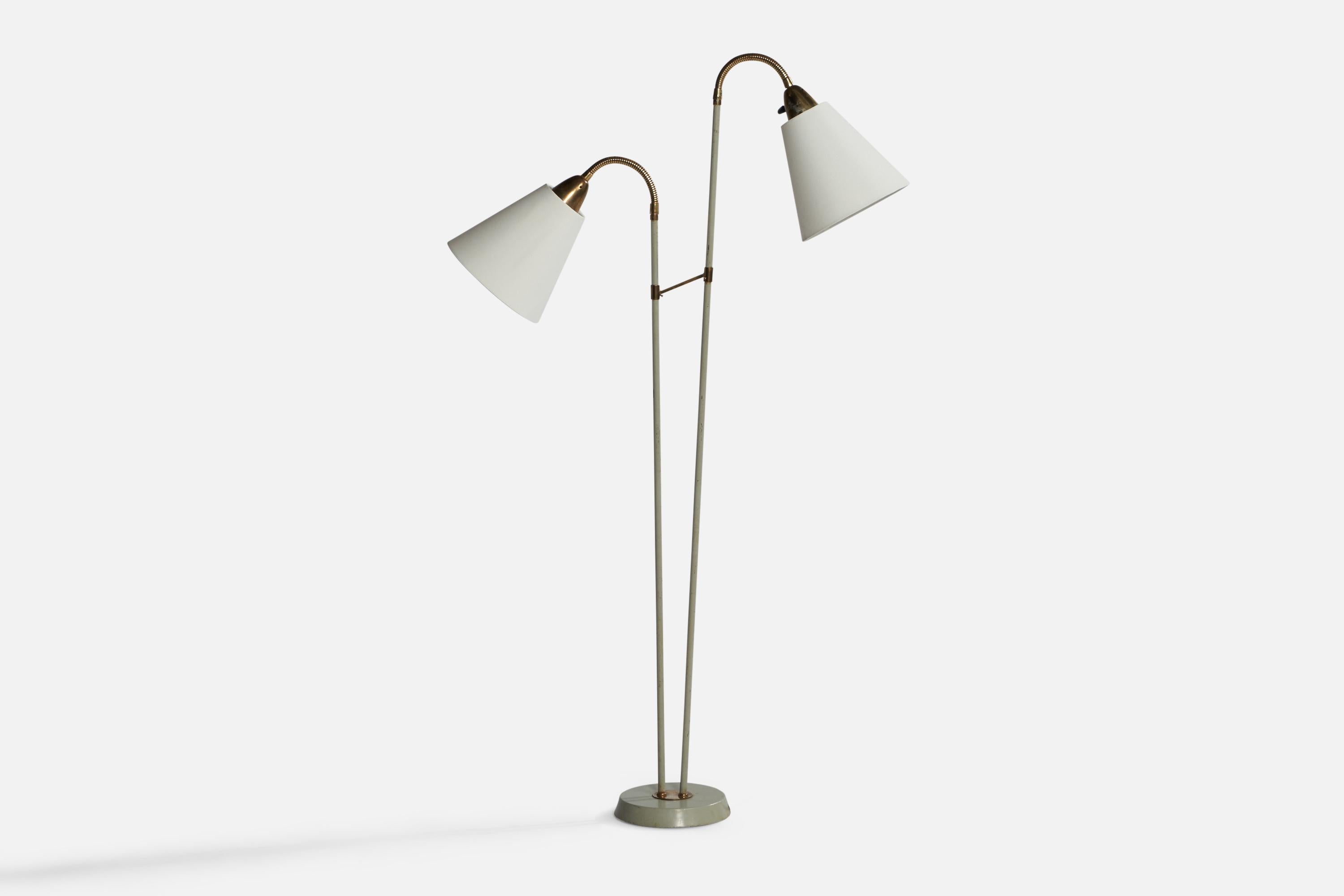 A brass and grey-lacquered metal and white fabric floor lamp designed and produced in Sweden, 1940s.

Overall Dimensions (inches): 55.5” H x 17” W x 19.5” D. Stated dimensions include shades.
Dimensions vary based on positions of lights.
Bulb