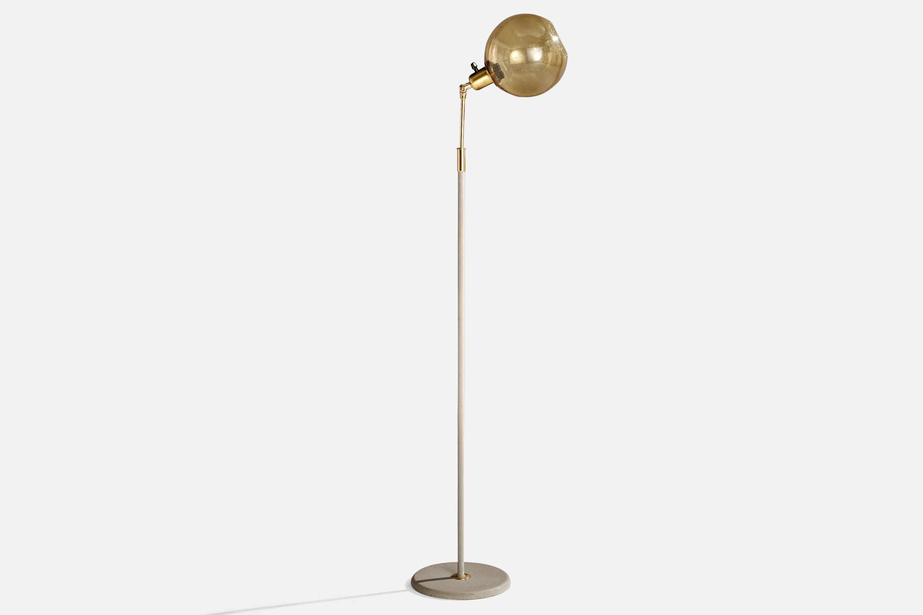 An adjustable bras, grey-lacquered metal and yellow glass floor lamp designed and produced in Sweden, c. 1950s.

Dimensions of Lamp with Shade (inches): 54