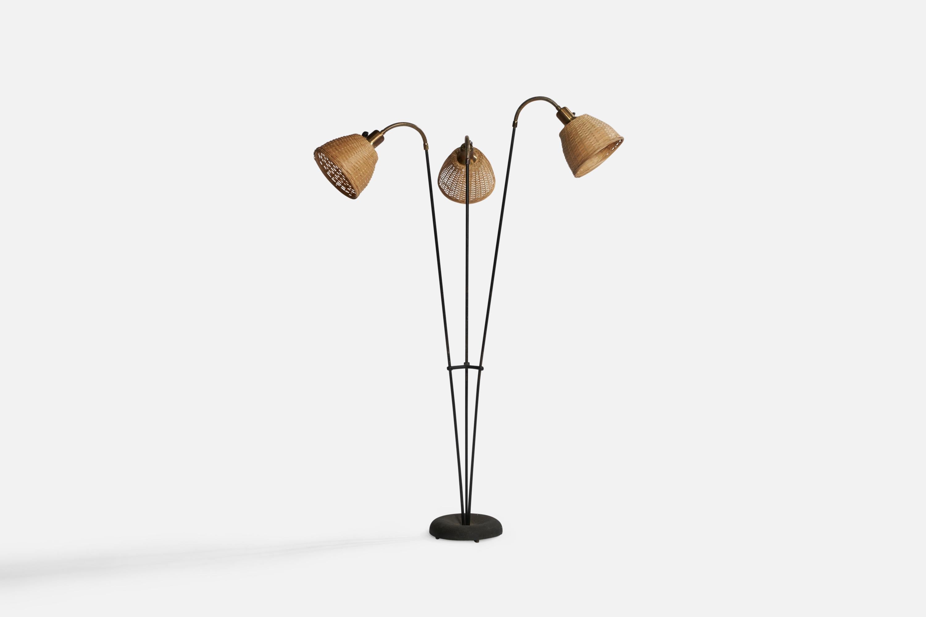 A brass and black-lacquered metal floor lamp designed and produced in Sweden, c. 1950s.

Overall Dimensions (inches): 51.8” H x 30.4” W x 25” D. Stated dimensions include shade.
Dimensions vary based on position of lights
Bulb Specifications: E-26