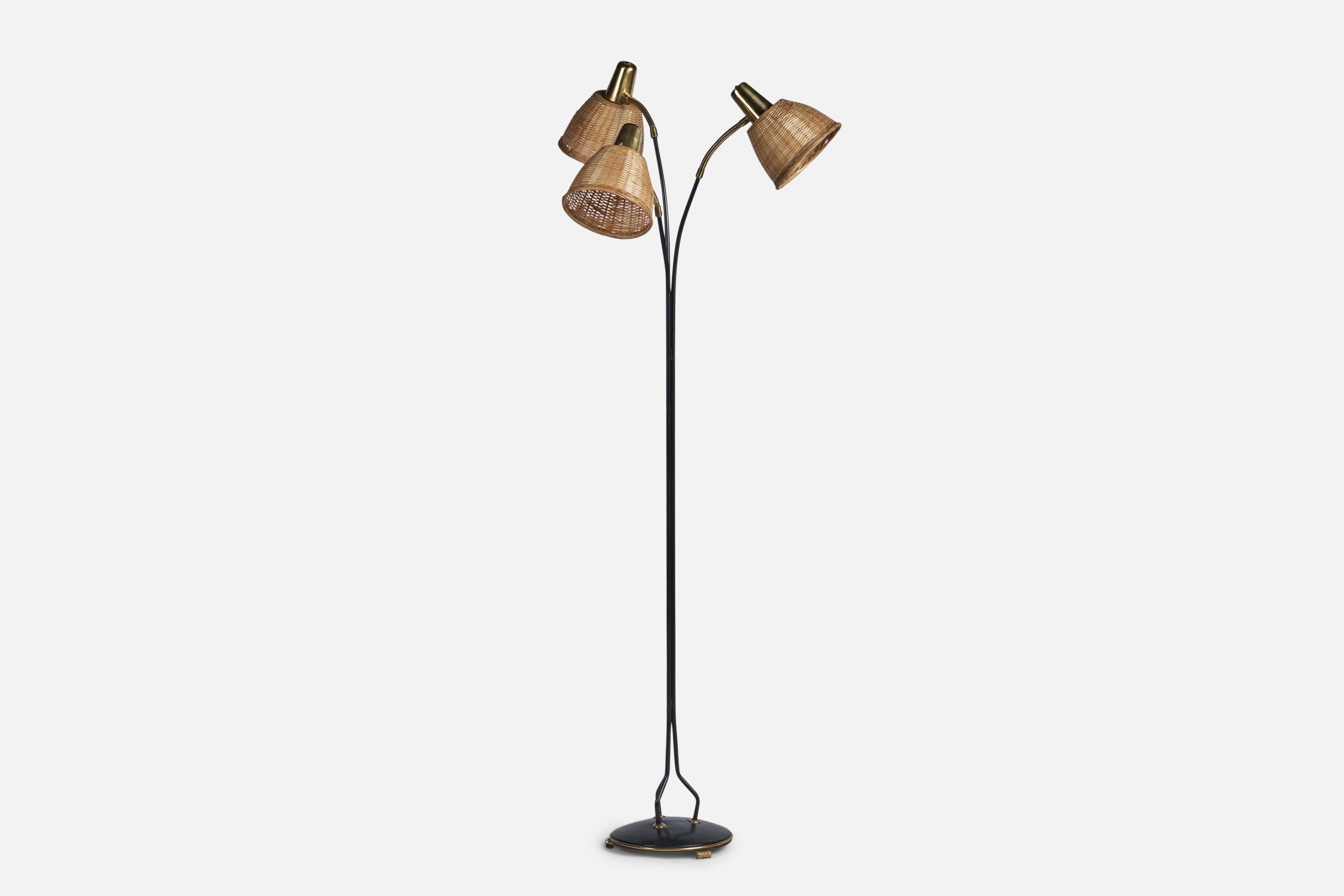 A three-armed adjustable brass, black-lacquered metal and rattan floor lamp designed and produced in Sweden, c. 1960s.

Overall Dimensions (inches): 59.5” H x 24” Diameter
Bulb Specifications: E-26 Bulb
Number of Sockets: 3
All lighting will be