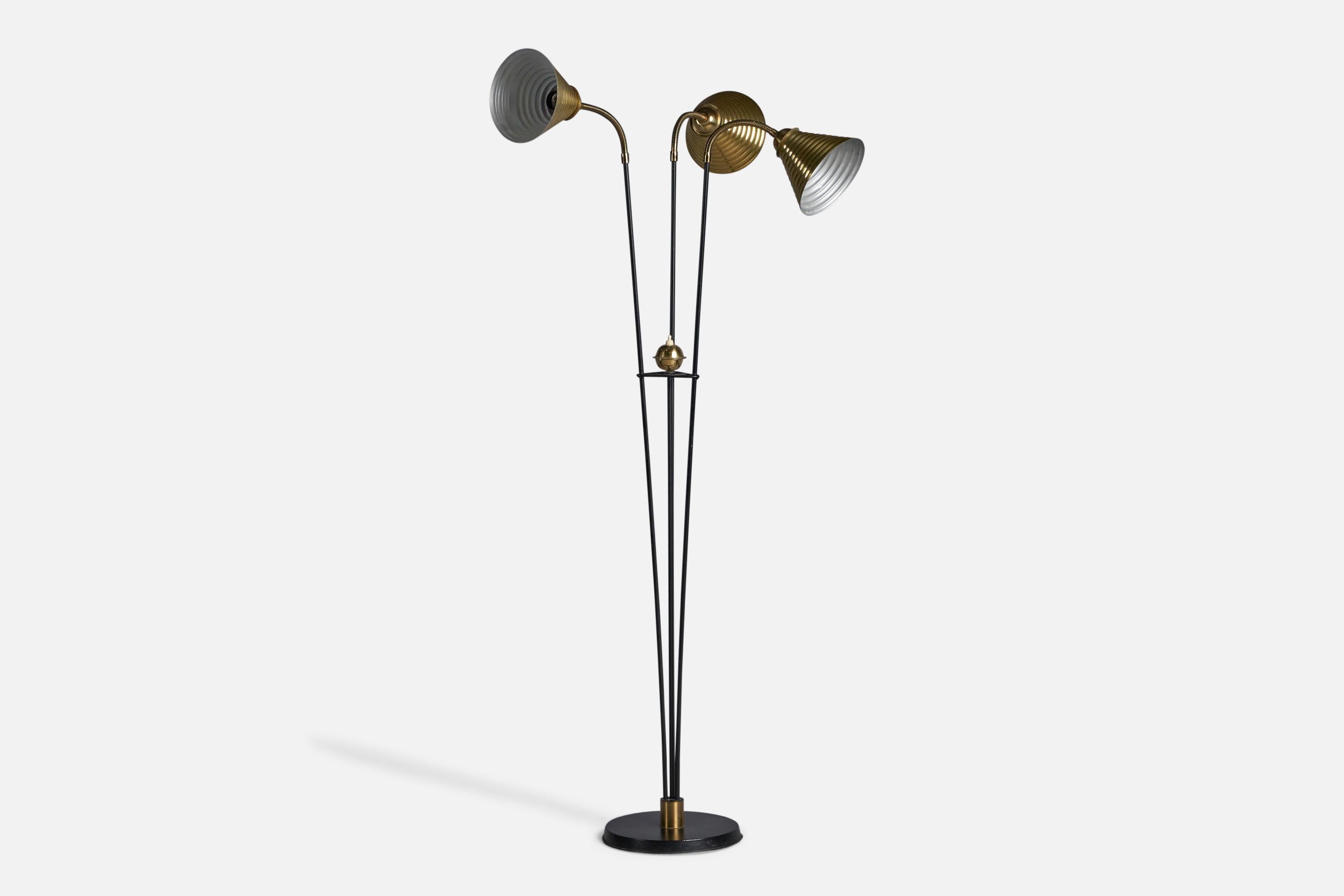 An adjustable three-armed brass and black-lacquered metal floor lamp, designed and produced in Sweden, c. 1950s.

Overall Dimensions (inches): 53.75