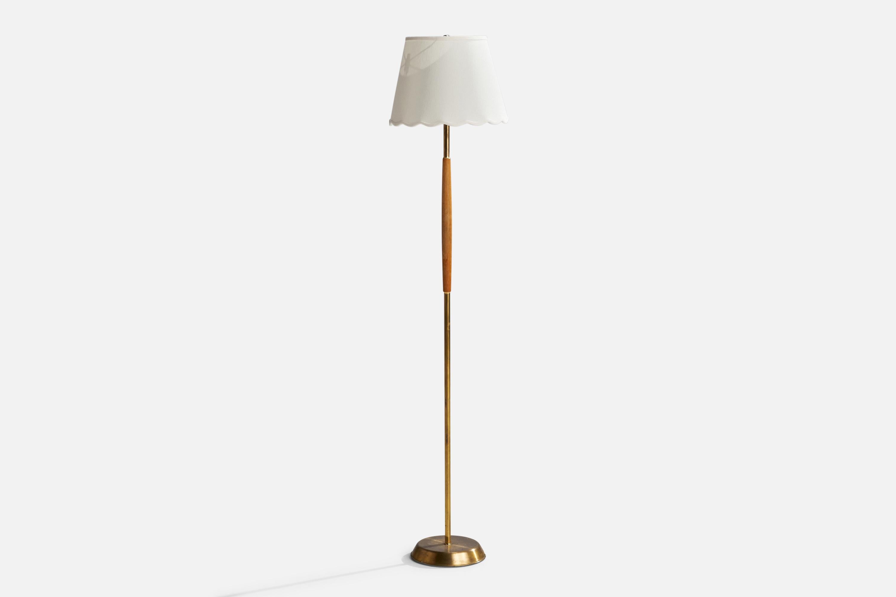 An oak, brass and fabric floor lamp designed and produced in Sweden, 1950s.

Overall Dimensions (inches): 55”  H x 12”  W x 13” D
Stated dimensions include shade.
Bulb Specifications: E-26 Bulb
Number of Sockets: 1
All lighting will be converted for