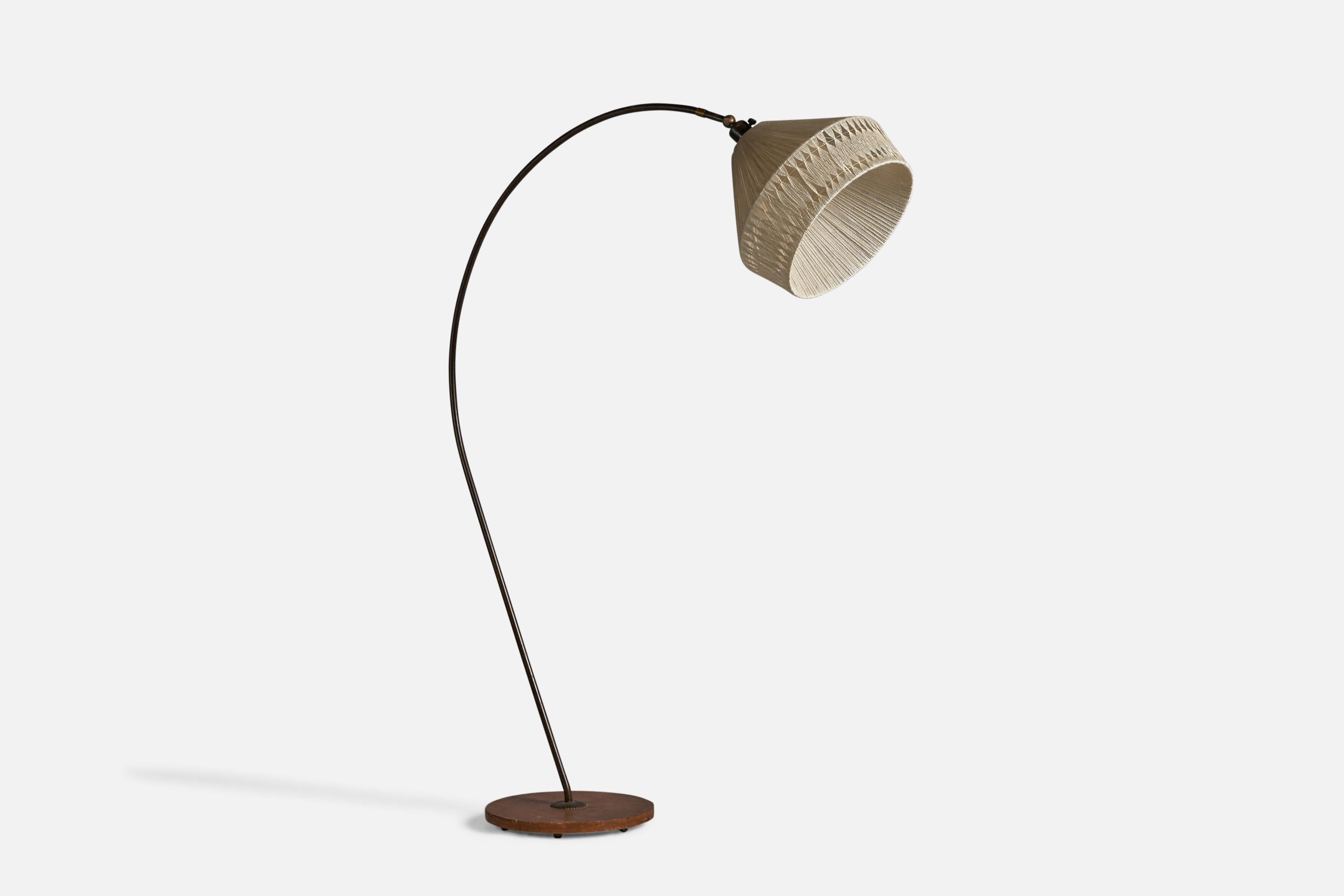 A curved brass, stained oak and string fabric floor lamp, designed and produced in Sweden, 1940s.

Overall Dimensions (inches): 58.5