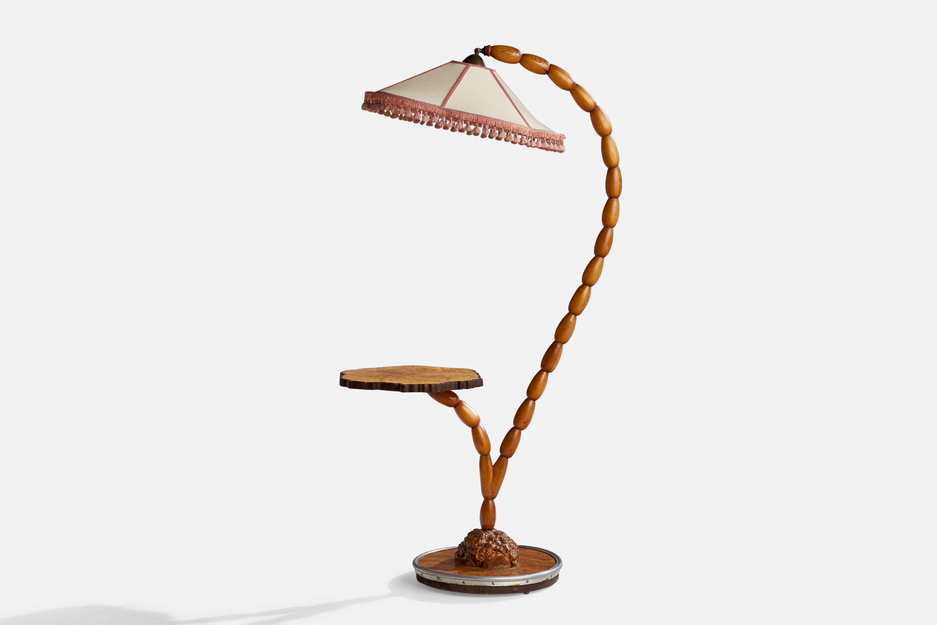 A pine, brass, metal, birch and fabric floor lamp with table designed and produced in Sweden, c. 1960s.

Overall Dimensions (inches): 63” H x 22.5”  W x 32.5”  D
Stated dimensions include shade.
Bulb Specifications: E-26 Bulb
Number of Sockets: