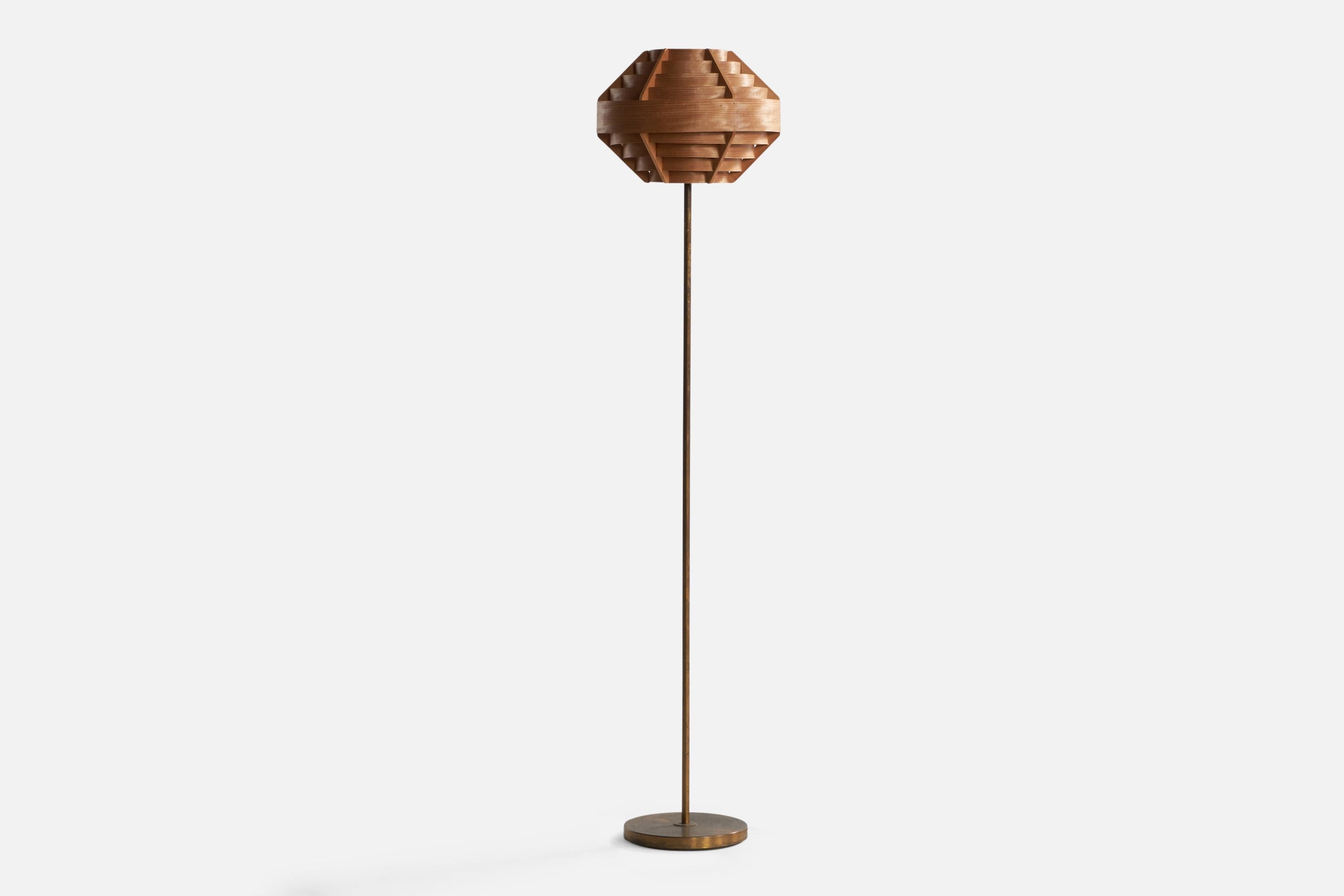 A brass, pine and moulded pine-veneer floor lamp designed and produced in Sweden, c. 1950s.
'
With an assorted lampshade by Hans-Agne Jakobsson.

Overall Dimensions (inches): 60.38” Height x 13.5” Diameter. Stated dimensions include shade.
Bulb
