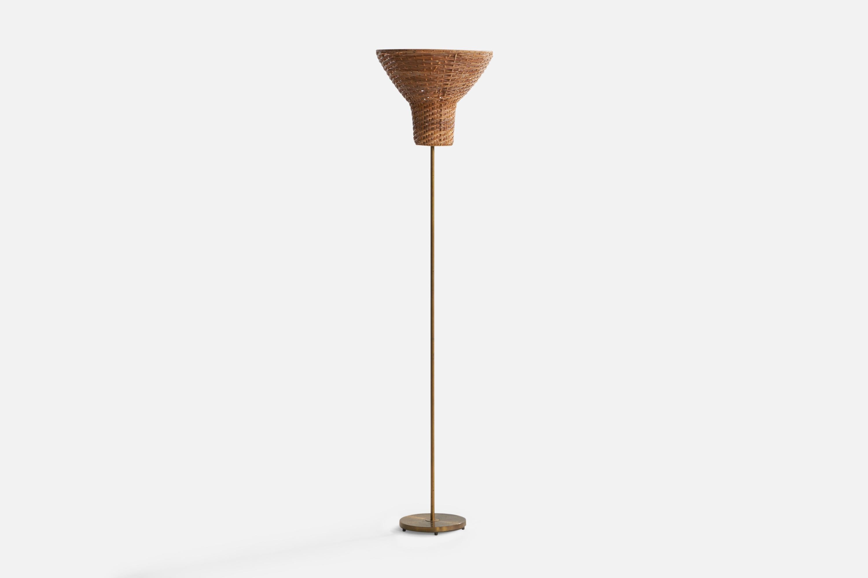A brass and rattan floor lamp designed and produced in Sweden, c. 1950s.

Overall Dimensions (inches): 56.8” H x 13.55” Diameter. Stated dimensions include shade.
Bulb Specifications: E-26 Bulb
Number of Sockets: 1
All lighting will be converted for