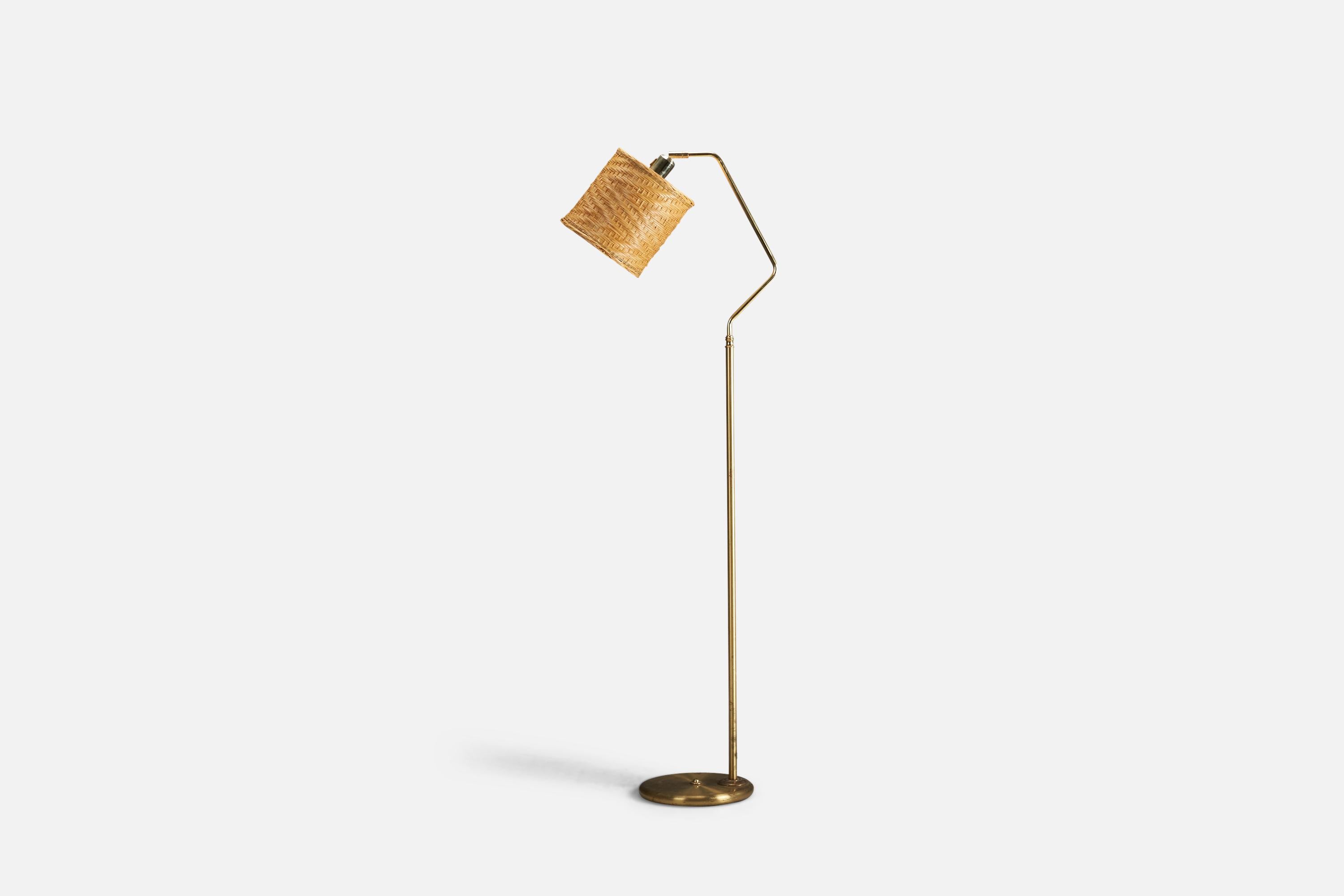 A brass and rattan floor lamp designed and produced by a Swedish Designer, Sweden, 1970s.

Socket takes standard E-26 medium base bulb.

There is no maximum wattage stated on the fixture.
