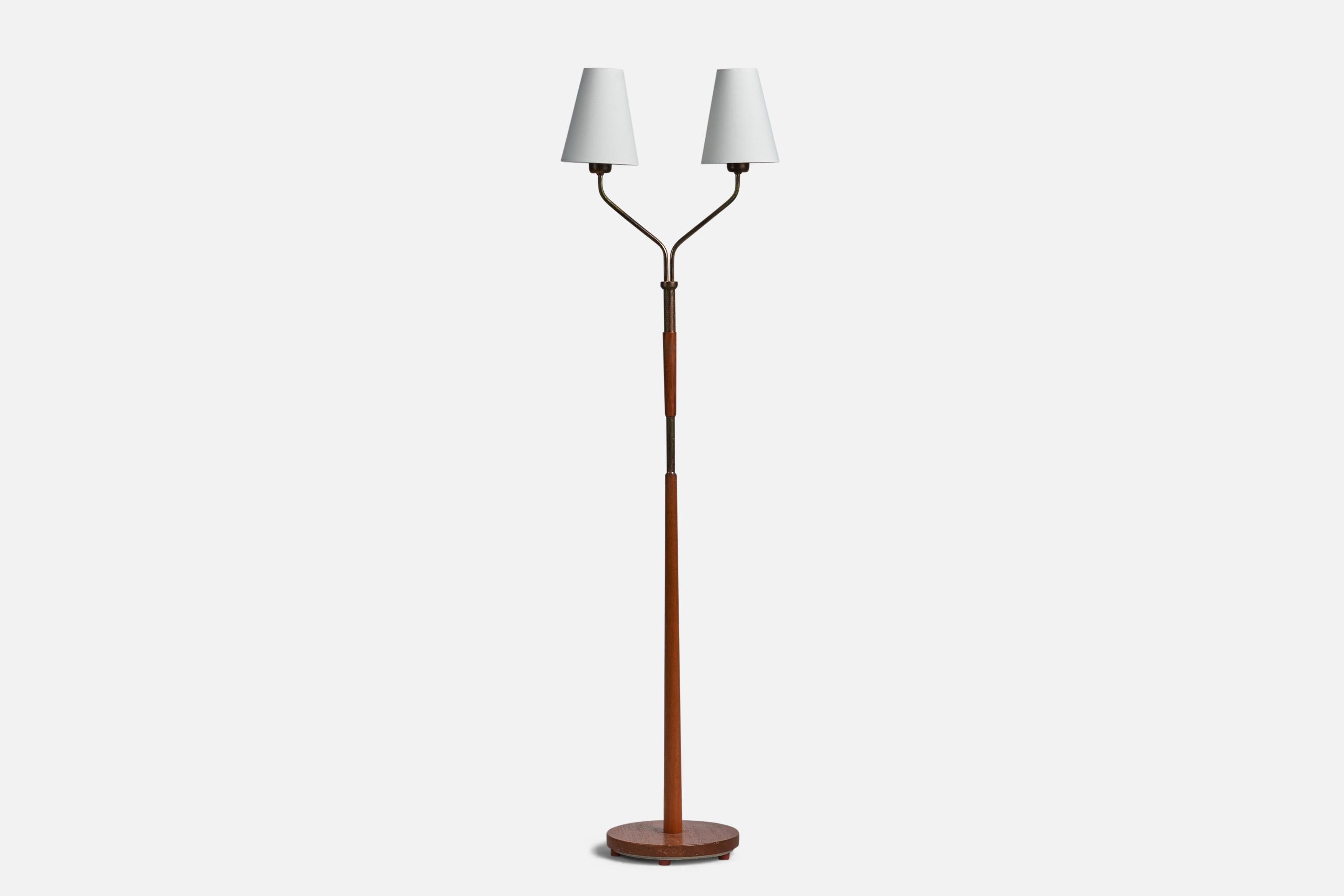 A brass, white fabric and teak floor lamp designed and produced in Sweden, 1950s.

Overall Dimensions (inches): 56” H x 15.25” W x 9.5” D
Bulb Specifications: E-26 Bulb
Number of Sockets: 2
All lighting will be converted for US usage. We are unable