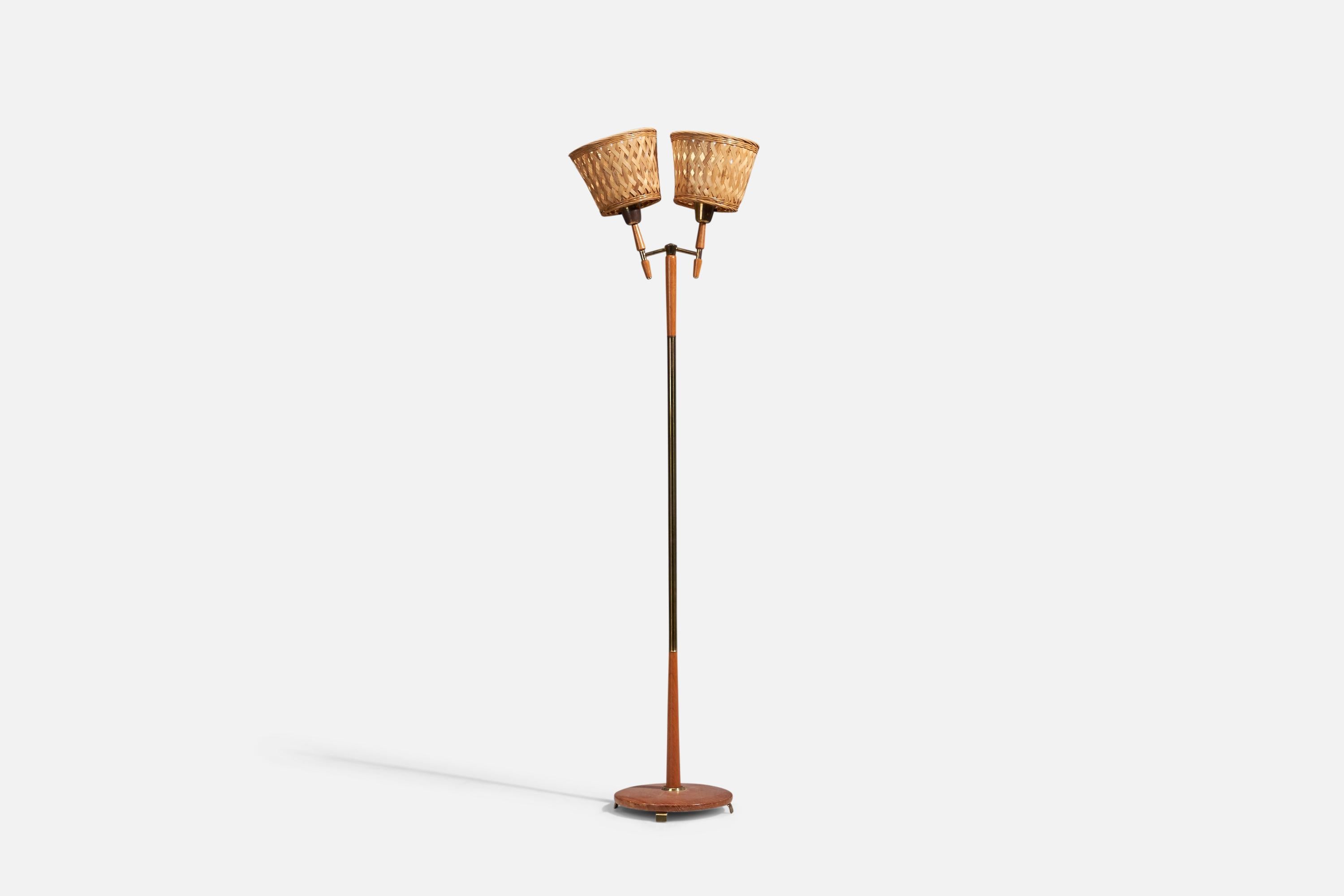 A brass, teak and rattan floor lamp designed and produced in Sweden, 1950s

Sold with Lampshades. Dimensions stated are of Floor Lamp with Lampshades.

Sockets take standard E-26 medium base bulbs.

There is no maximum wattage stated on the