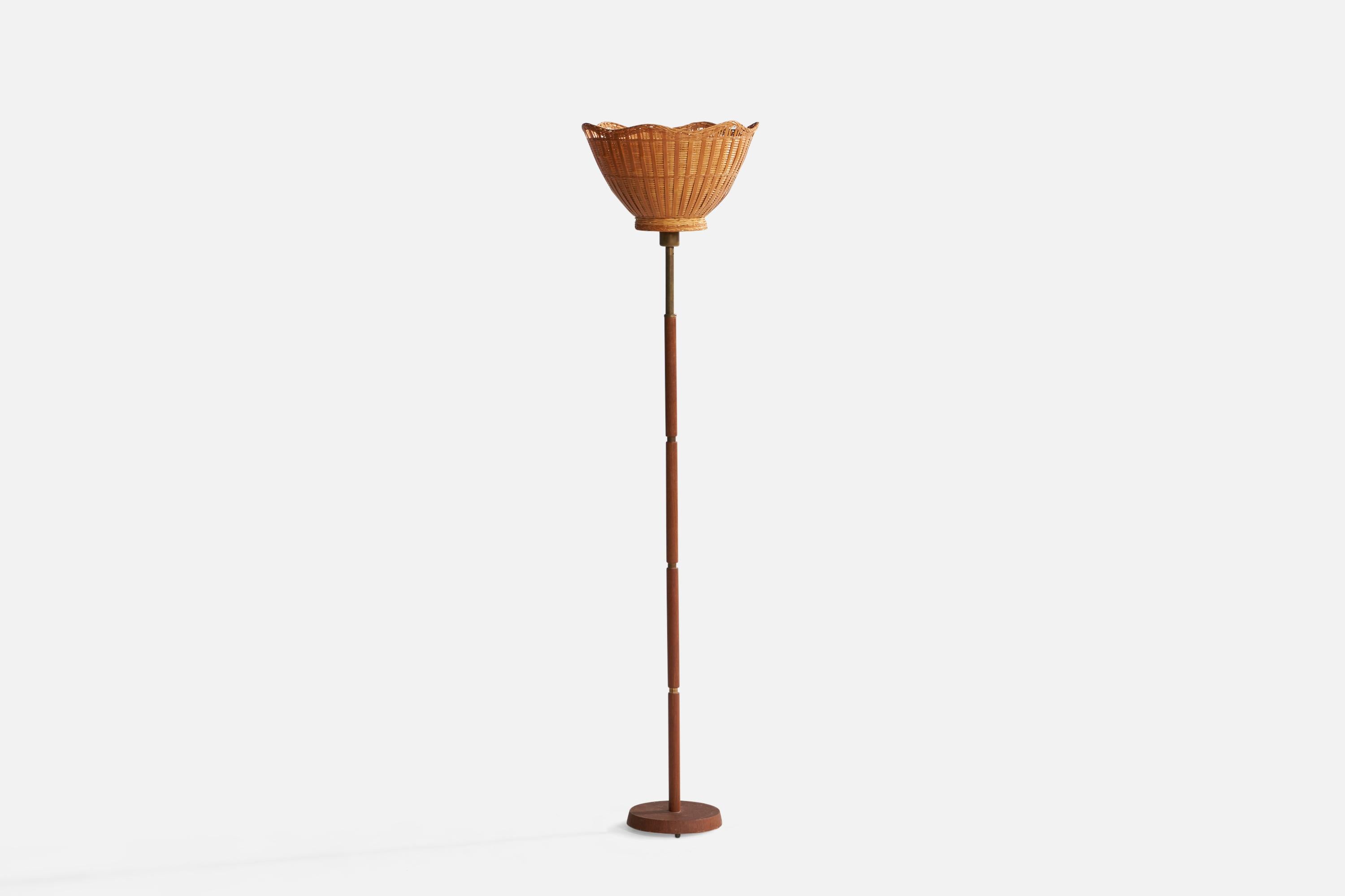 A brass, teak and rattan floor lamp designed and produced in Sweden, 1950s.

Overall Dimensions (inches): 57.38” H x 13.75” Diameter. Stated dimensions include shade.
Bulb Specifications: E-26 Bulb
Number of Sockets: 1
All lighting will be converted