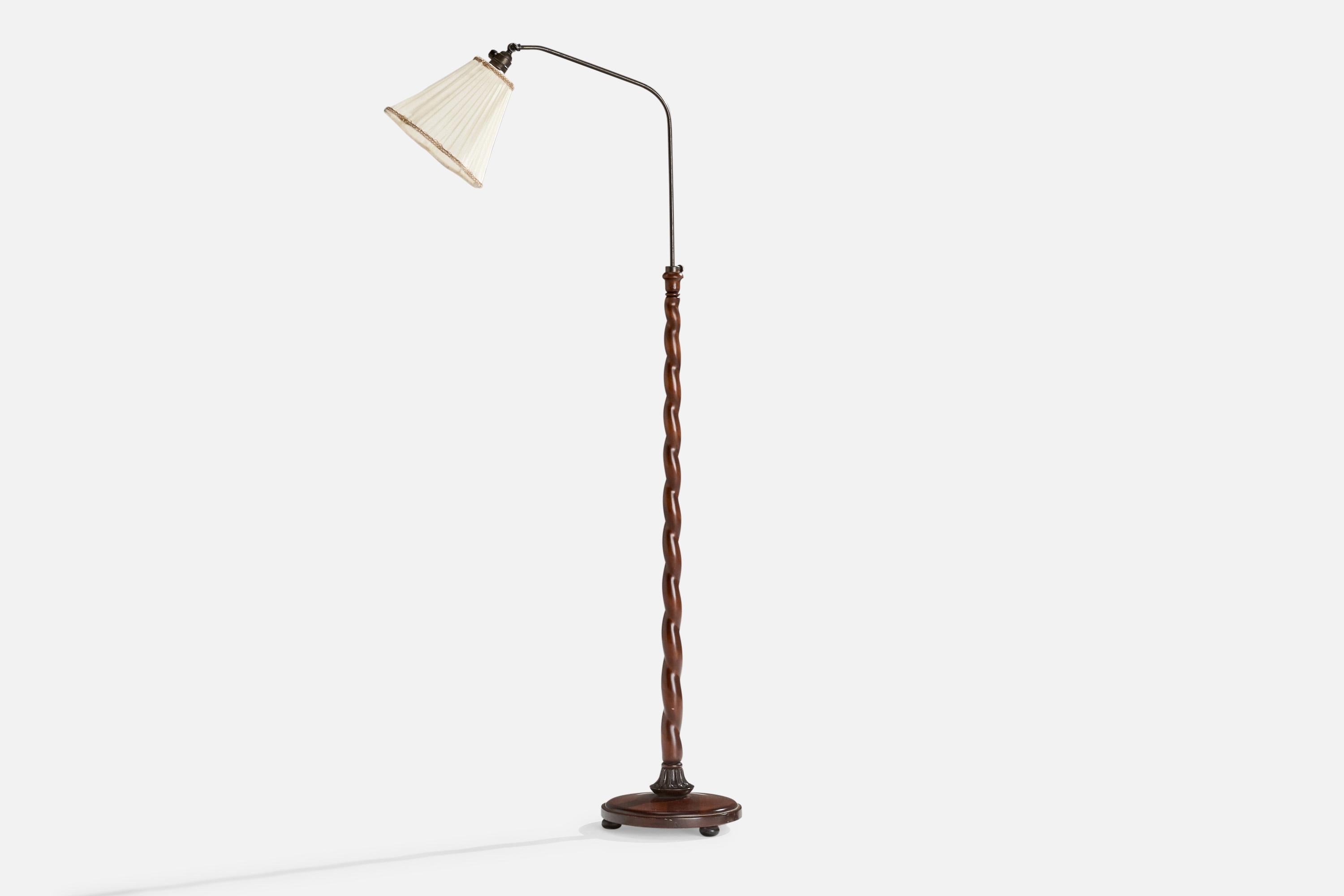 An adjustable brass, wood and off white fabric floor lamp designed and produced in Sweden, c. 1930s.

Dimensions variable 
Overall Dimensions (inches): 52” H x 9.5” W x 25” D
Stated dimensions include shade.
Bulb Specifications: E-26 Bulb
Number of