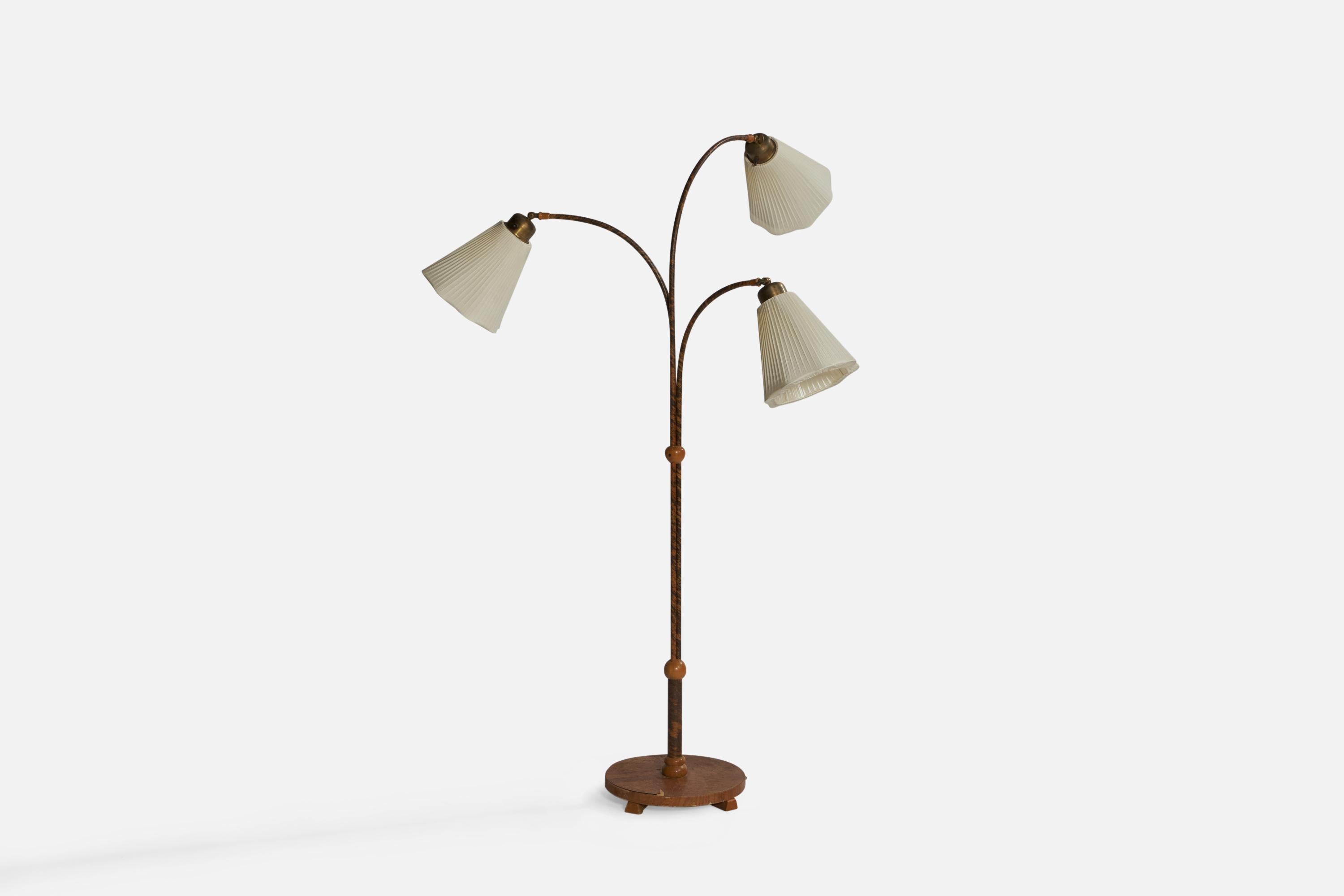 An adjustable three-armed brass, elm, wood veneer and off-white fabric floor lamp designed and produced in Sweden, c. 1940s.

Overall Dimensions (inches): 60.75” x 43.5” W x 32.5” D. Stated dimensions include shades.
Dimensions vary based on