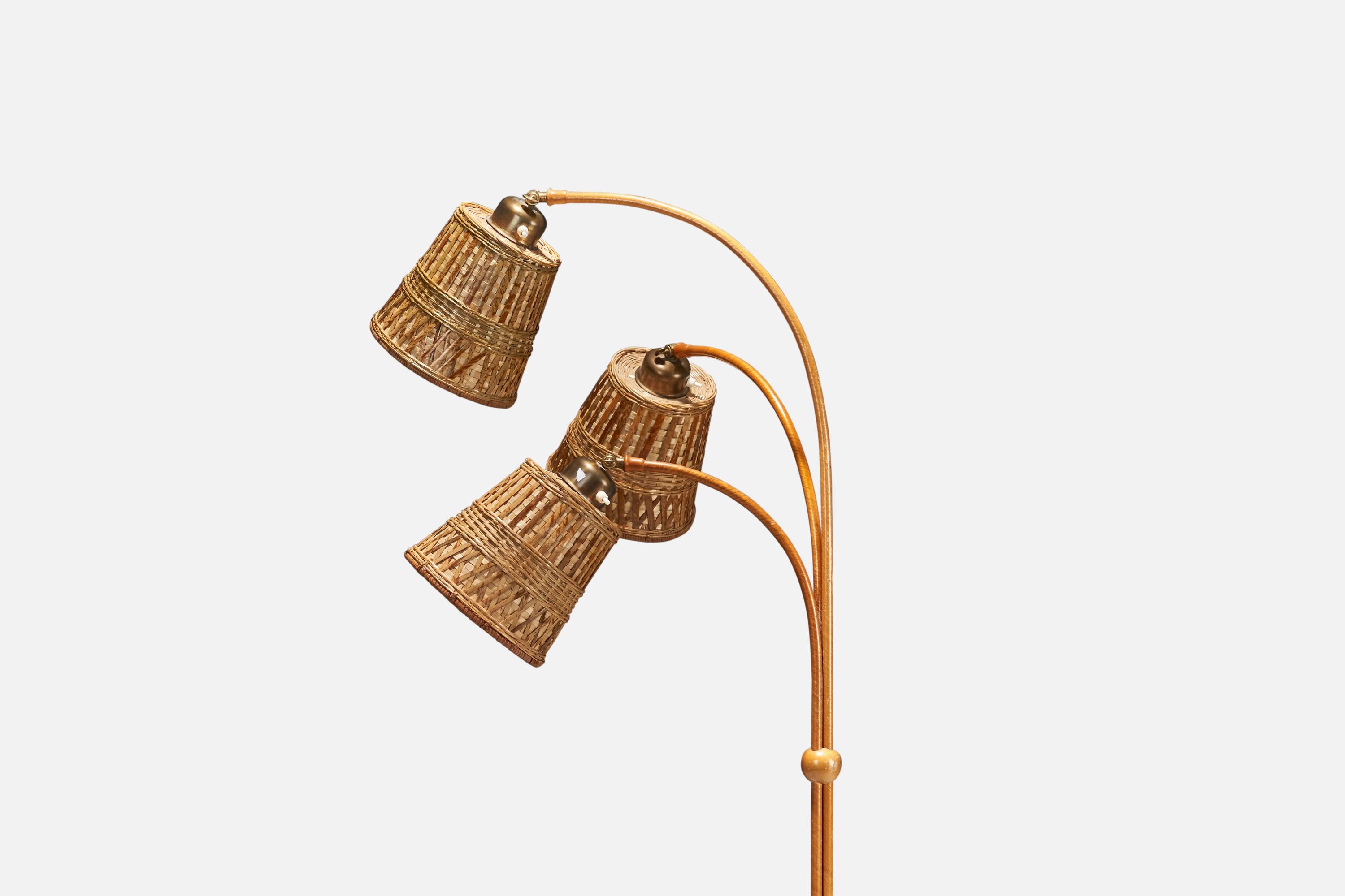 A wood, brass, Veneer and rattan floor lamp designed and produced in Sweden, 1930s.

Dimensions variable, measured as illustrated in first image.

Sold with Lampshades. Dimensions stated are of Floor Lamp with Lampshades. 

Sockets take