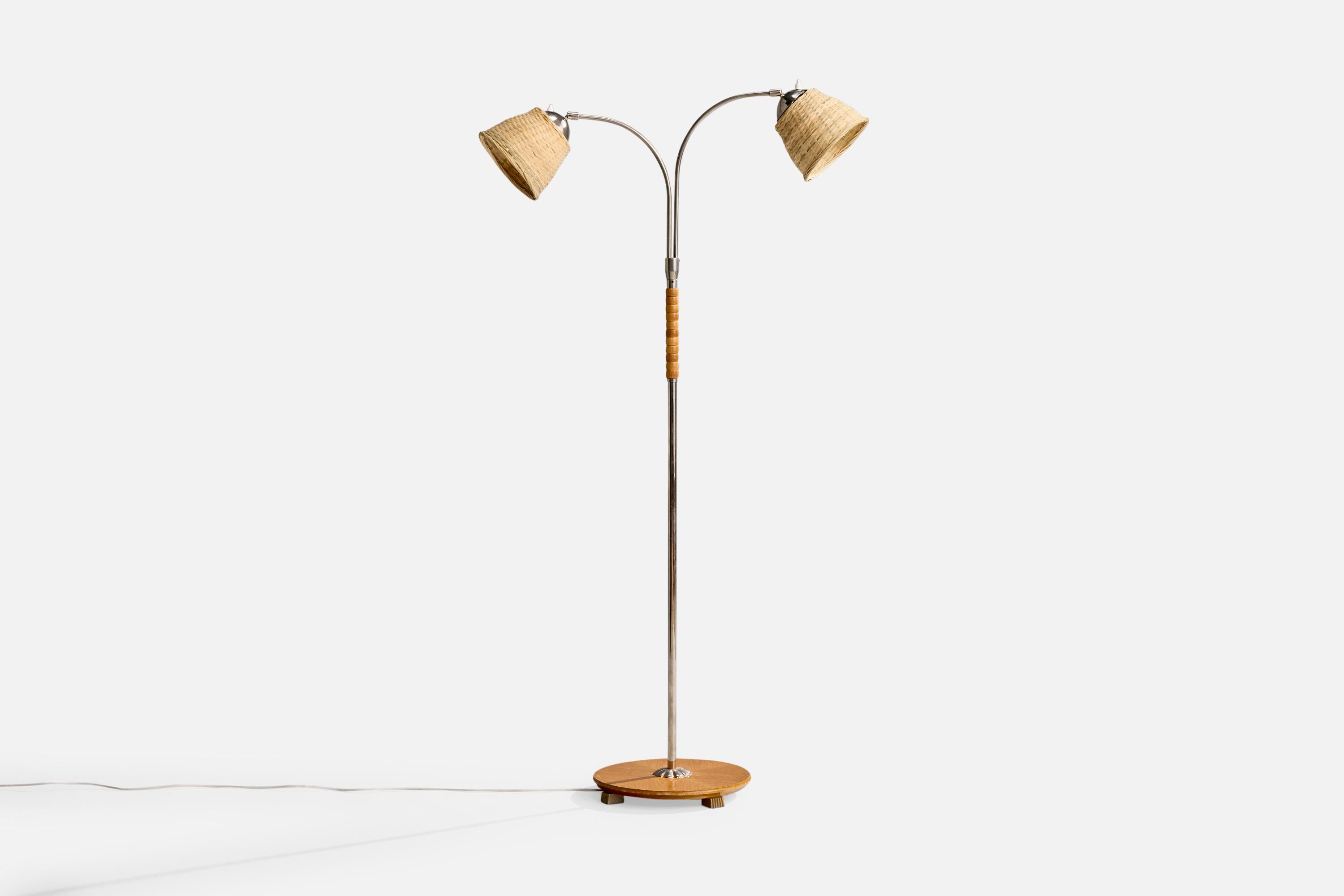 A chrome, wood and rattan floor lamp designed and produced by a Swedish designer, Sweden, c. 1940s.

Overall Dimensions (inches): 57.25