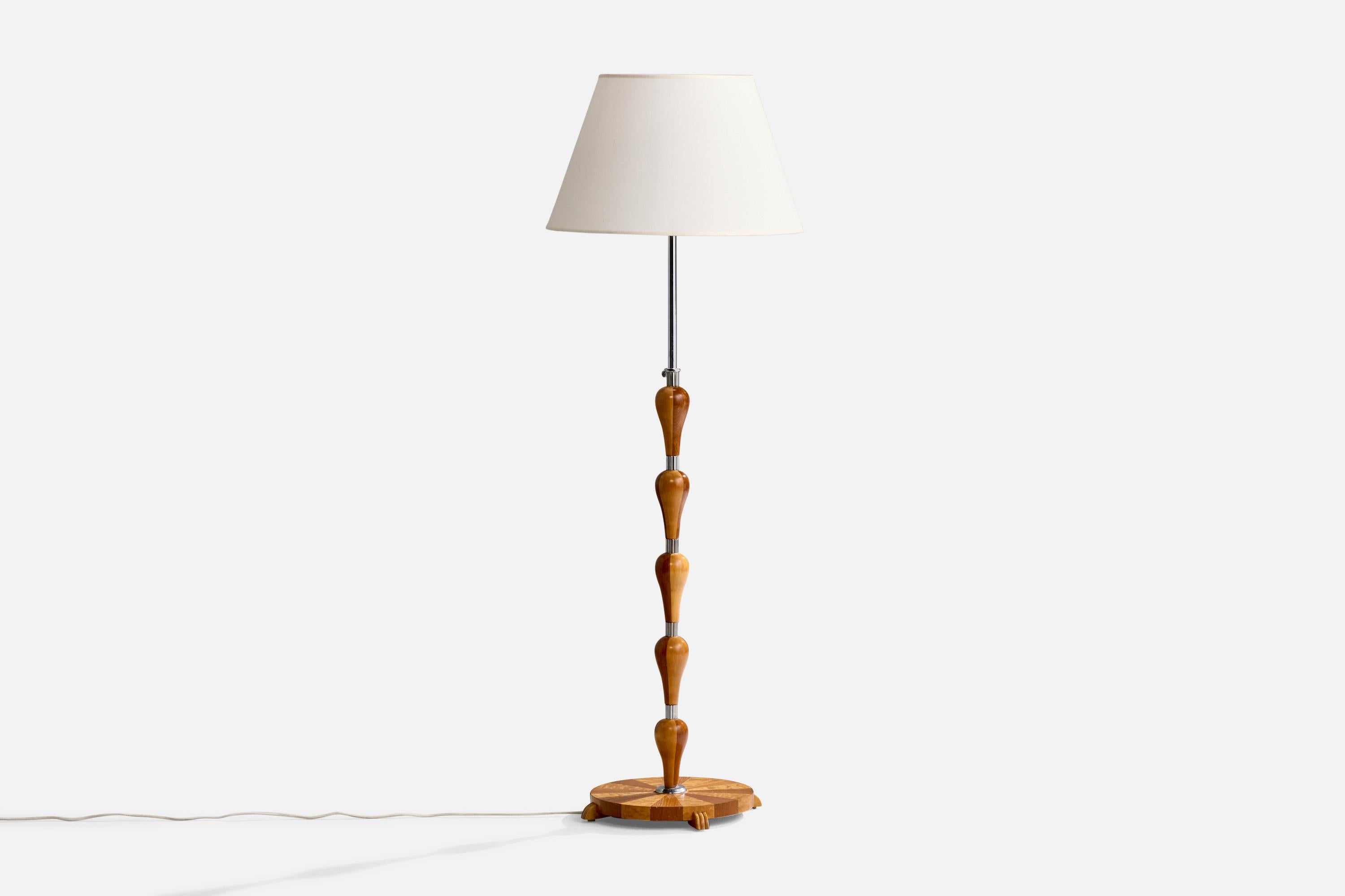 A chrome-plated metal, white fabric and inlaid wood floor lamp designed and produced in Sweden, c. 1930s.

Overall Dimensions (inches): 64