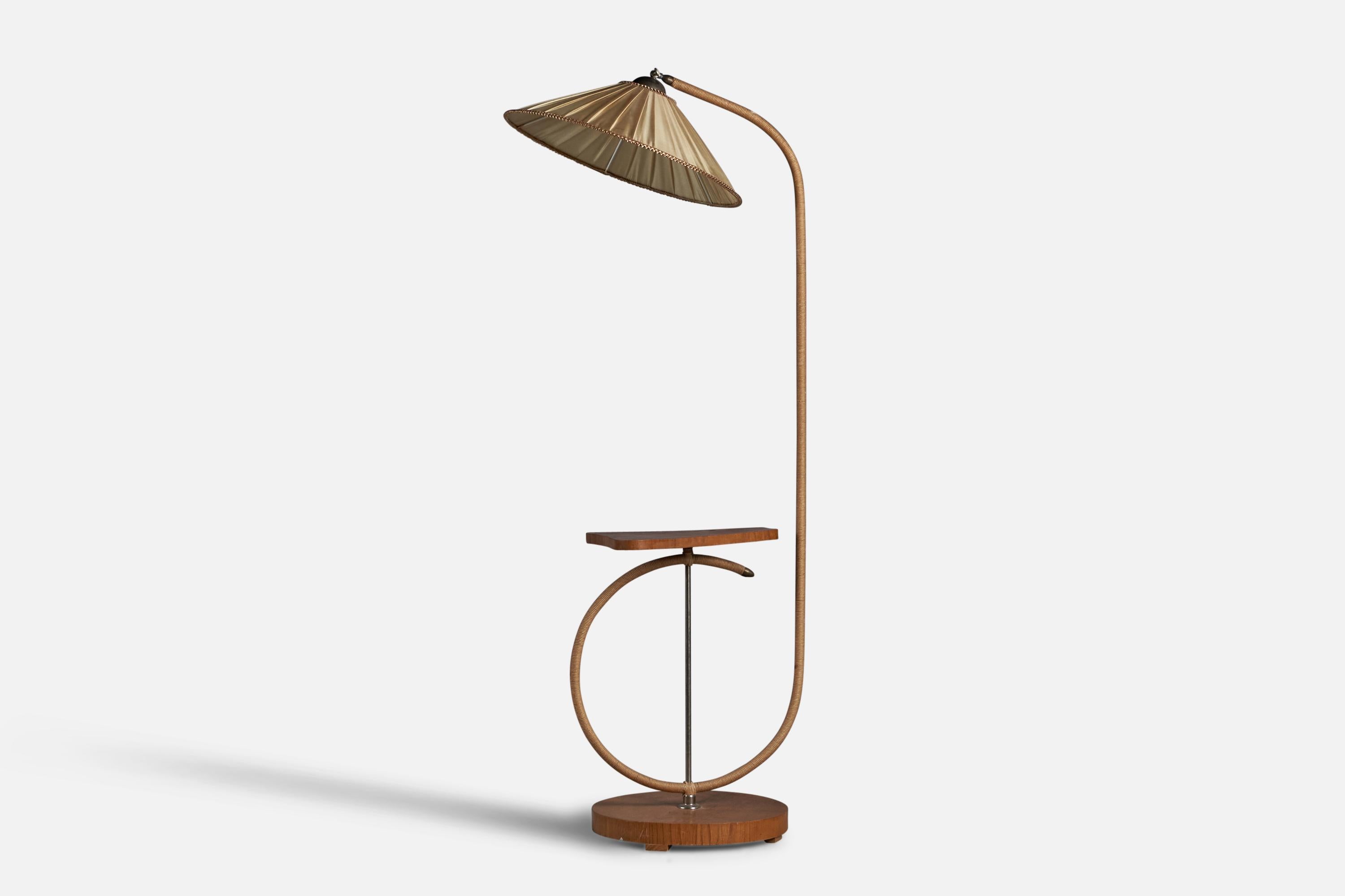 A cord, brass, elm and beige fabric floor lamp with side table designed and produced in Sweden, c. 1930s.

Overall Dimensions (inches): 65” H x 21.25” W x 25” D
Table Dimensions (inches): 25.25” H x 13.5” W x 15.25” D
Bulb Specifications: E-26