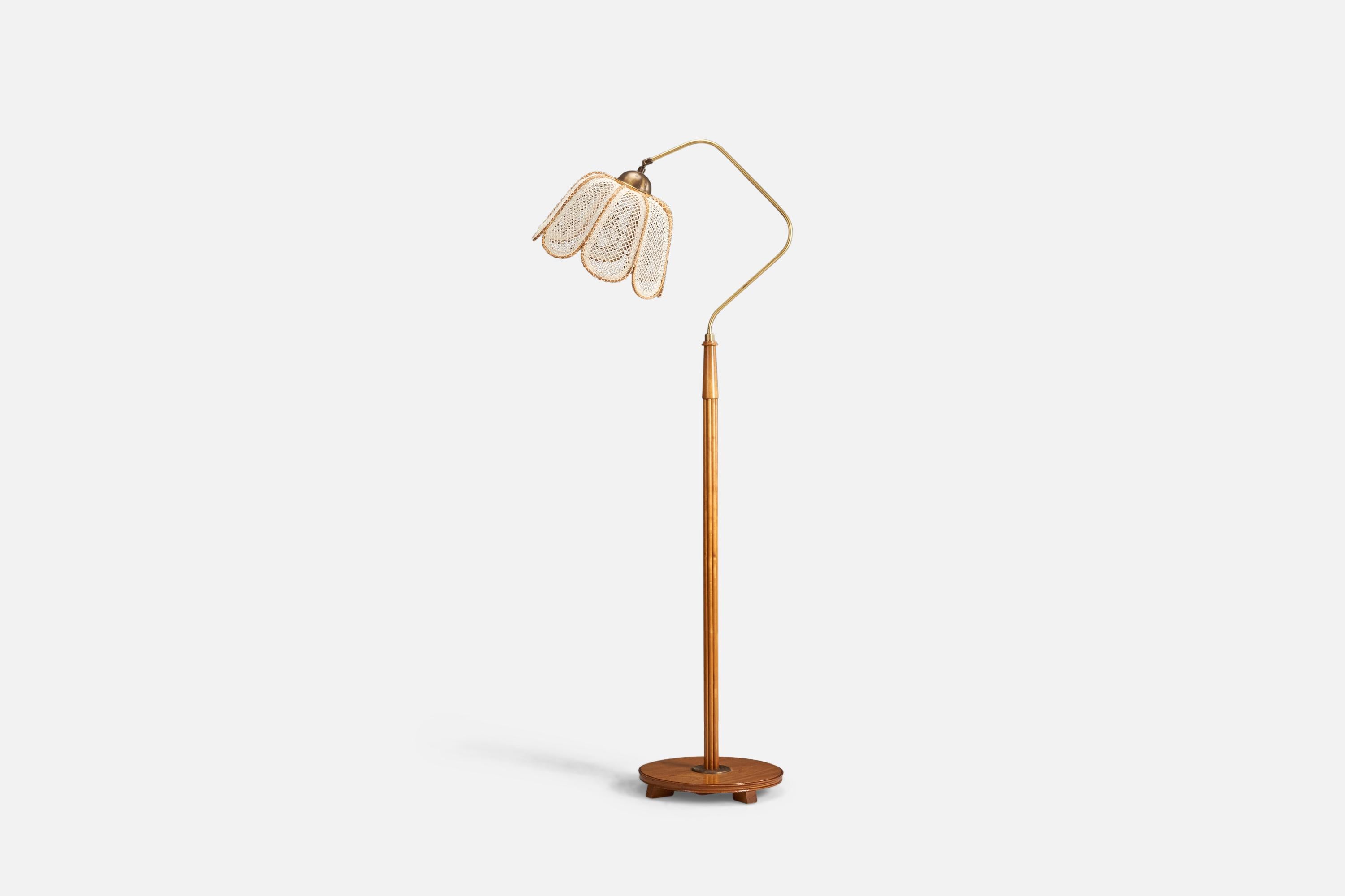An elm, brass and embroidery fabric floor lamp designed and produced by a Swedish Designer, Sweden, 1930s.

Socket takes standard E-26 medium base bulb.

There is no maximum wattage stated on the fixture.