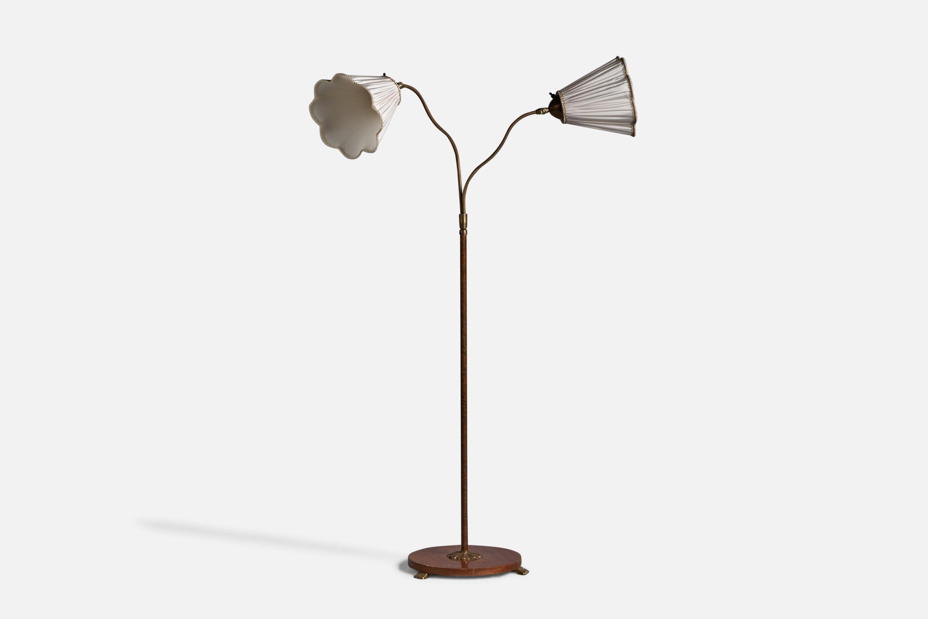 An adjustable two-armed elm, brass, wood veneer and fabric floor lamp, designed and produced in Sweden, 1930s.

Overall Dimensions (inches): 
Bulb Specifications: E-26 Bulb
Number of Sockets: 2
