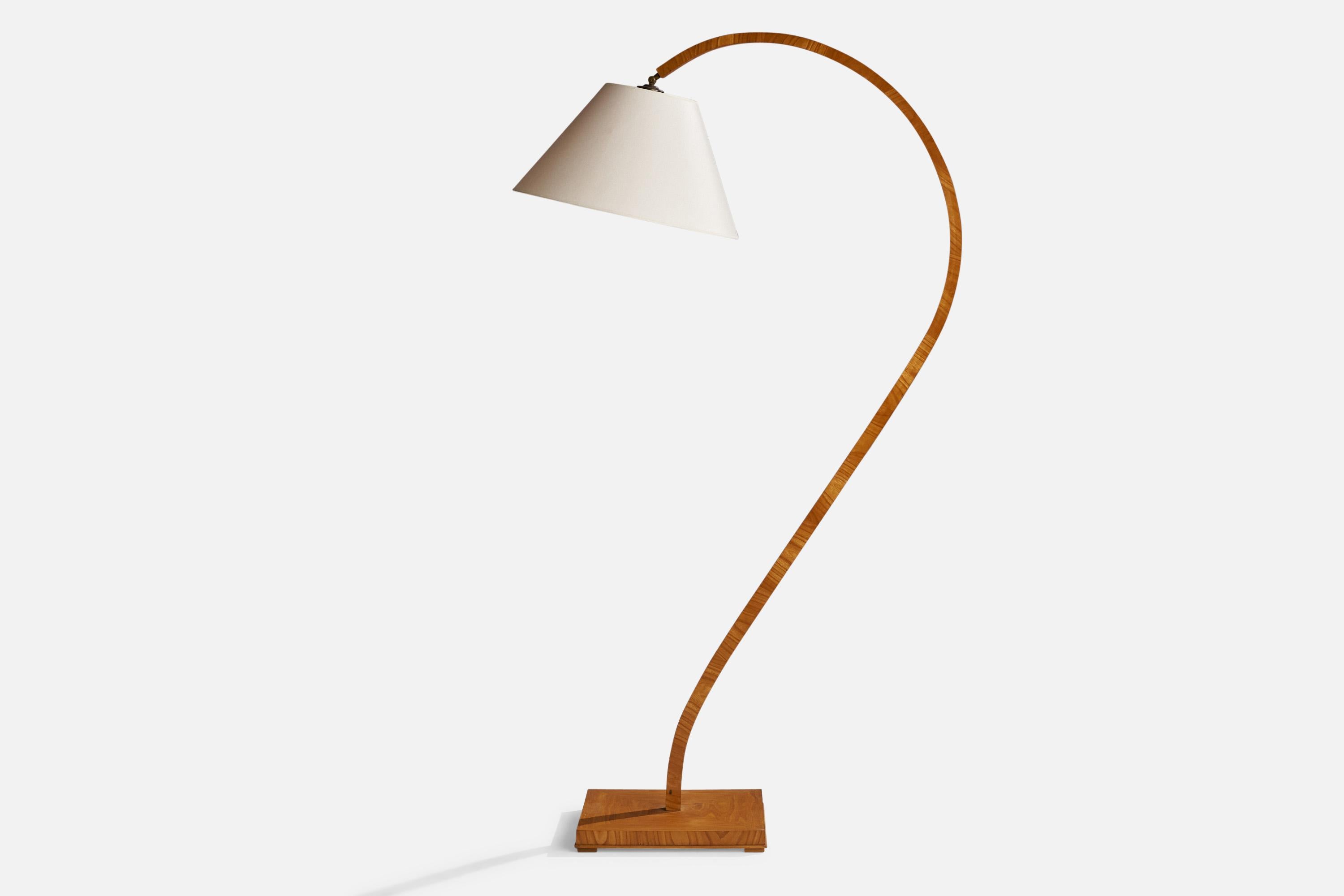 A brass, elm and off-white fabric floor lamp designed and produced in Sweden, 1940s.

Overall Dimensions (inches): 67.5” H x 19.5”  W x 39”  D
Stated dimensions include shade.
Bulb Specifications: E-26 Bulb
Number of Sockets: 1
All lighting will be